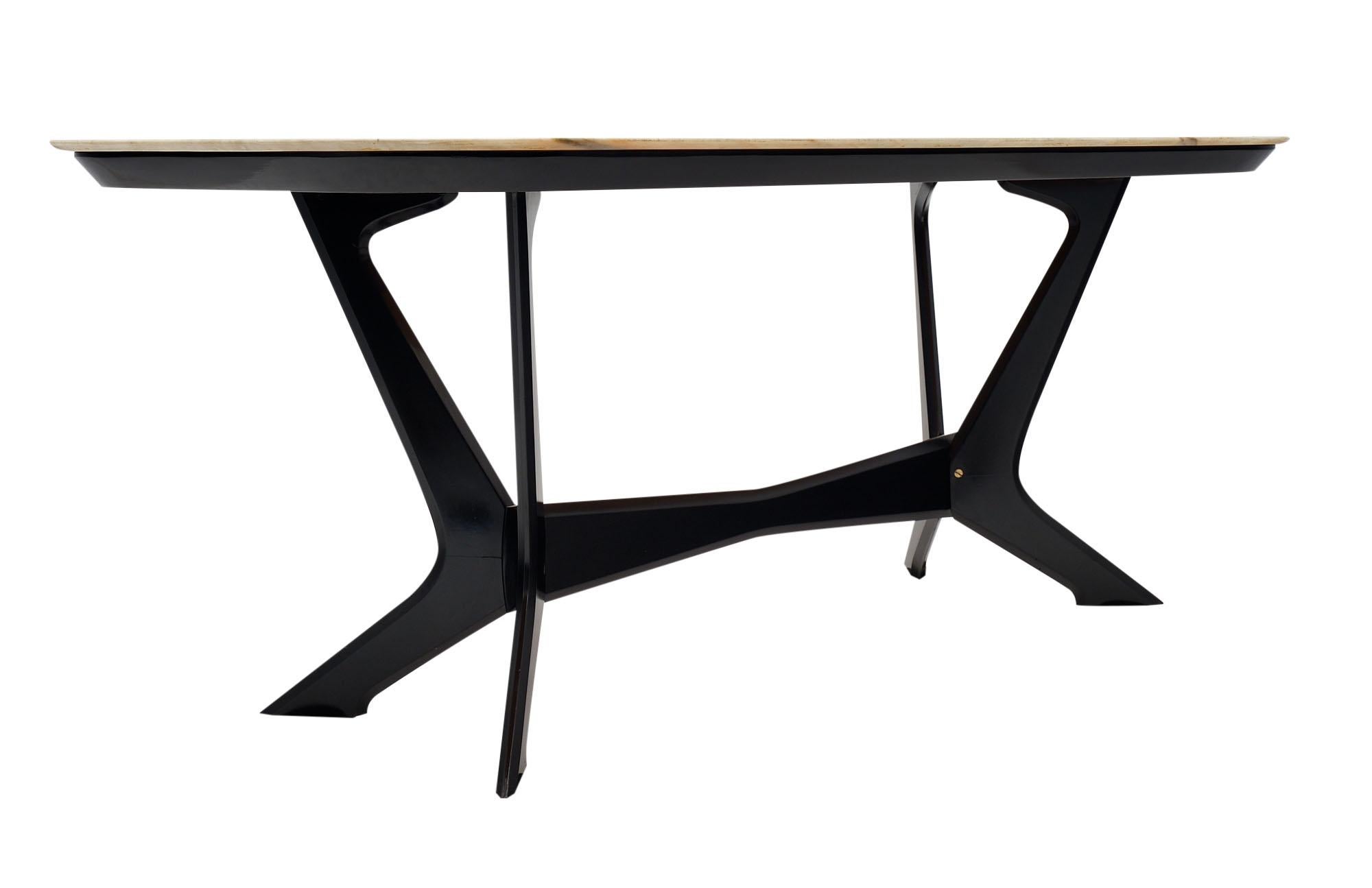 Dining table from Italy attributed to Italian designer Ico Parisi. This piece has a solid mahogany base that has been ebonized and finished with a French polish. The top is an original intact onyx marble top.