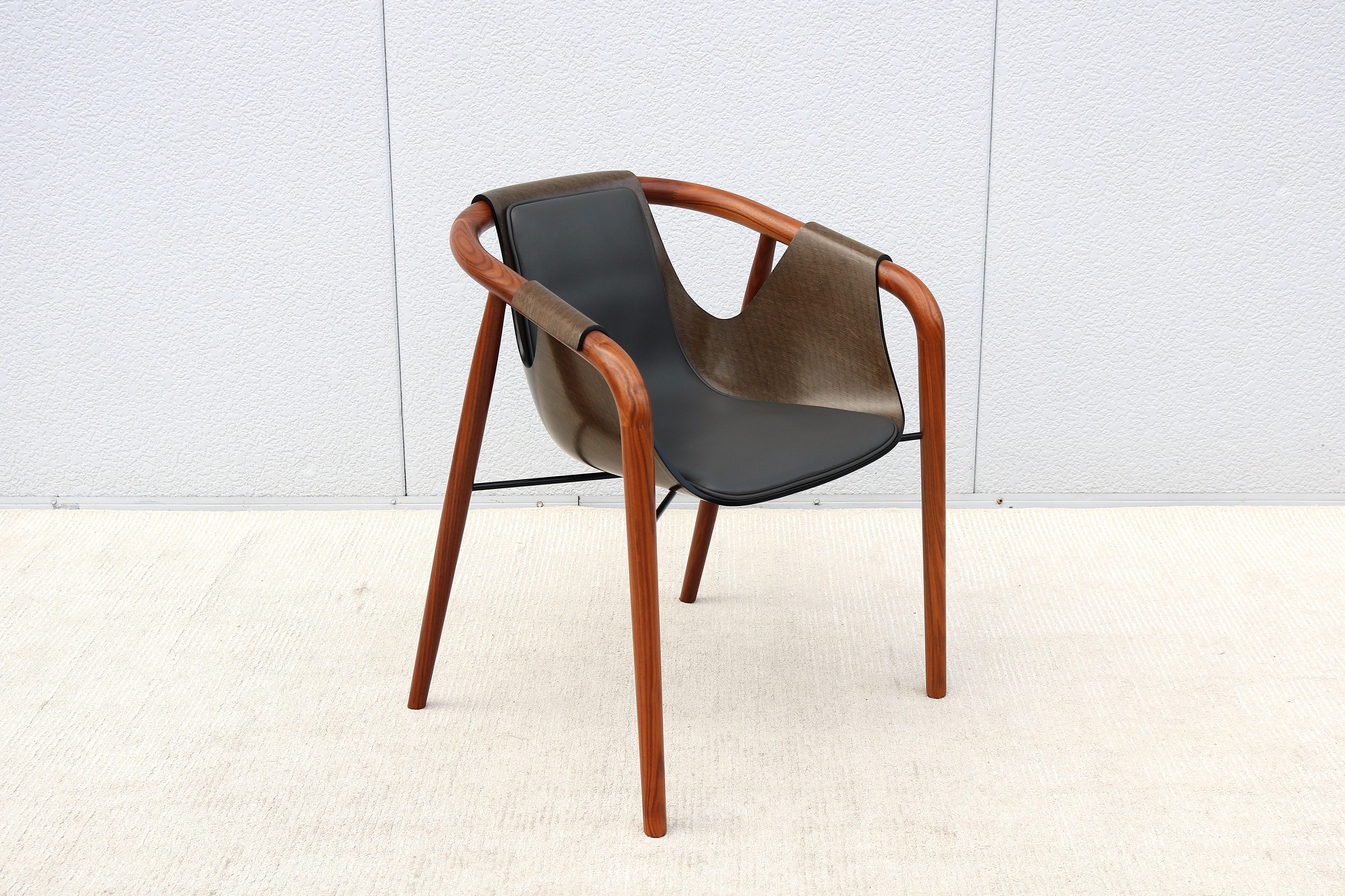 Fabulous Hamac armchair designed by Jean Philippe Nuel and handcrafted in Italy by Saintluc and Amura.
The seat shell was conceived as a drape resting on a wooden structure, as if it were a soft fabric present under the resin, as if time had frozen