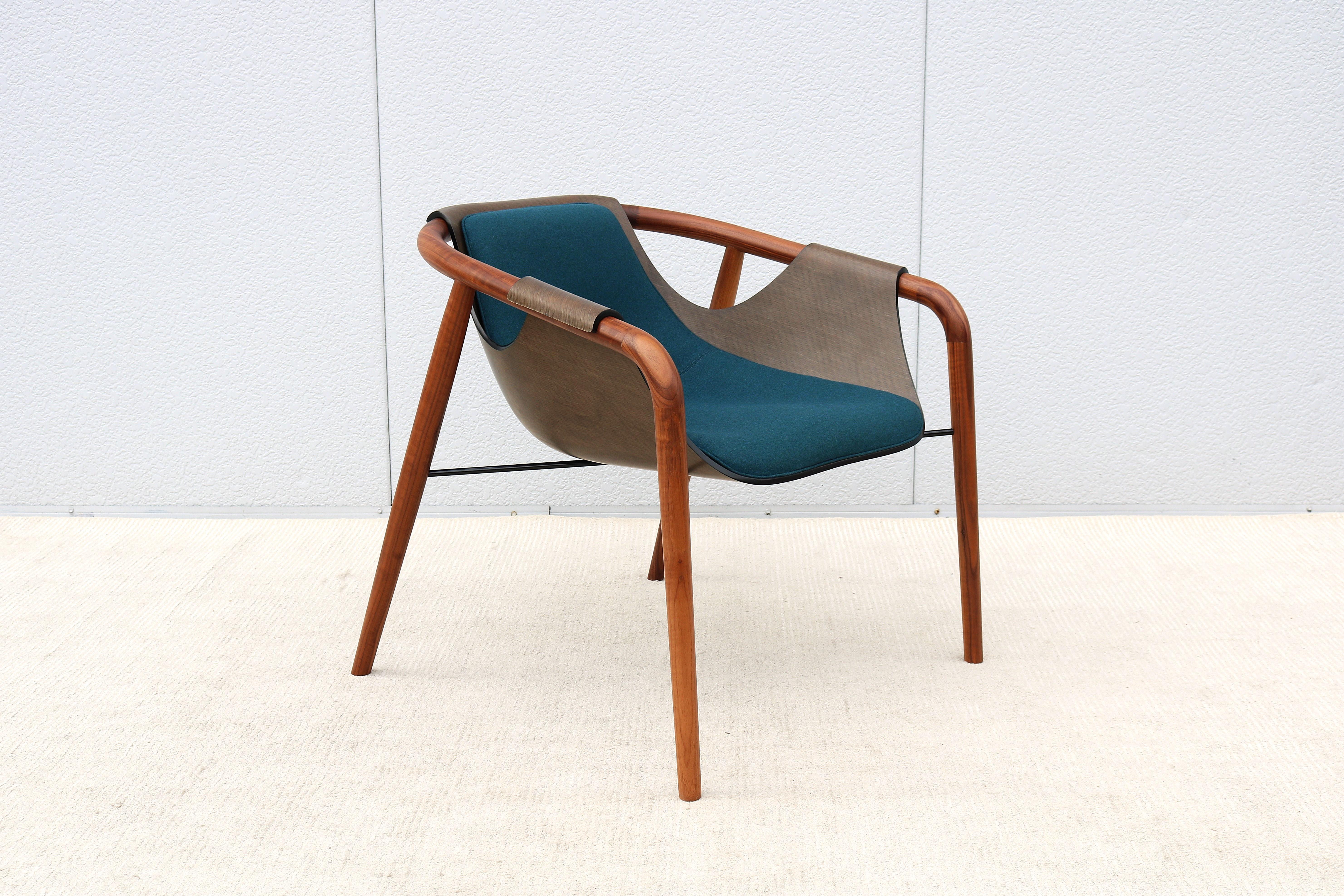 Fabulous Hamac lounge armchair designed by Jean Philippe Nuel and handcrafted in Italy by Saintluc and Amura.
The seat shell was conceived as a drape resting on a wooden structure, as if it were a soft fabric present under the resin, as if time had