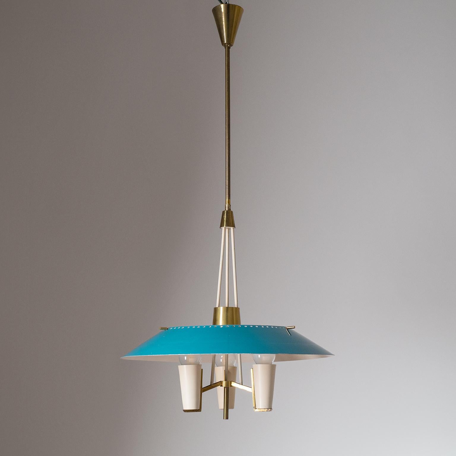 Rare modernist Italian lantern or chandelier from the 1950s. Sculptural brass structure with a large lacquered aluminum shade. Nice condition with patina on the brass and some light wear to the original lacquer. Three original brass E14 sockets with
