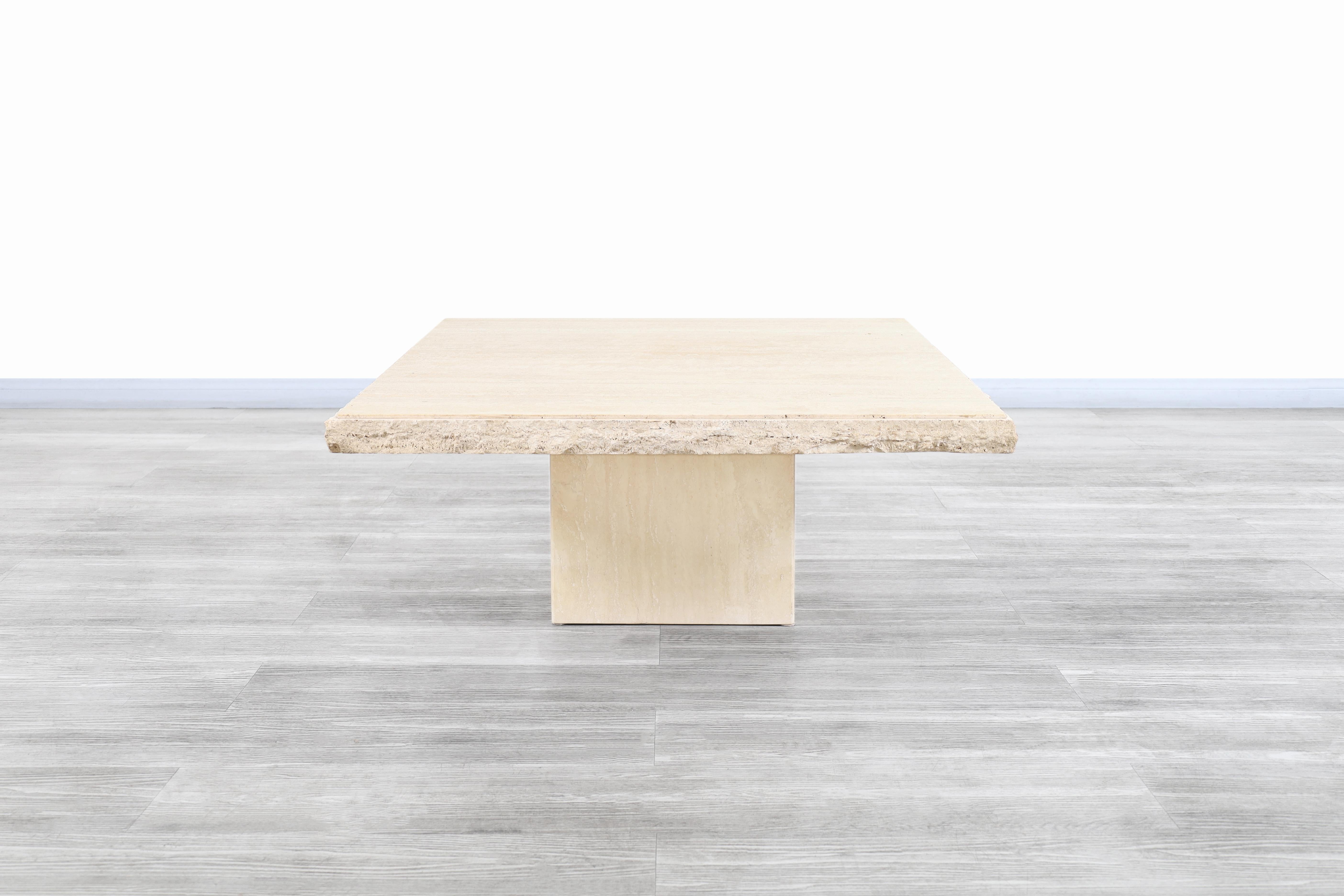 Wonderful Italian Modernist Edge travertine coffee tables designed and manufactured in Italy, circa 1970s. The modernist design is perfectly complemented by the natural minerals of the travertine stone. The table features a square travertine top