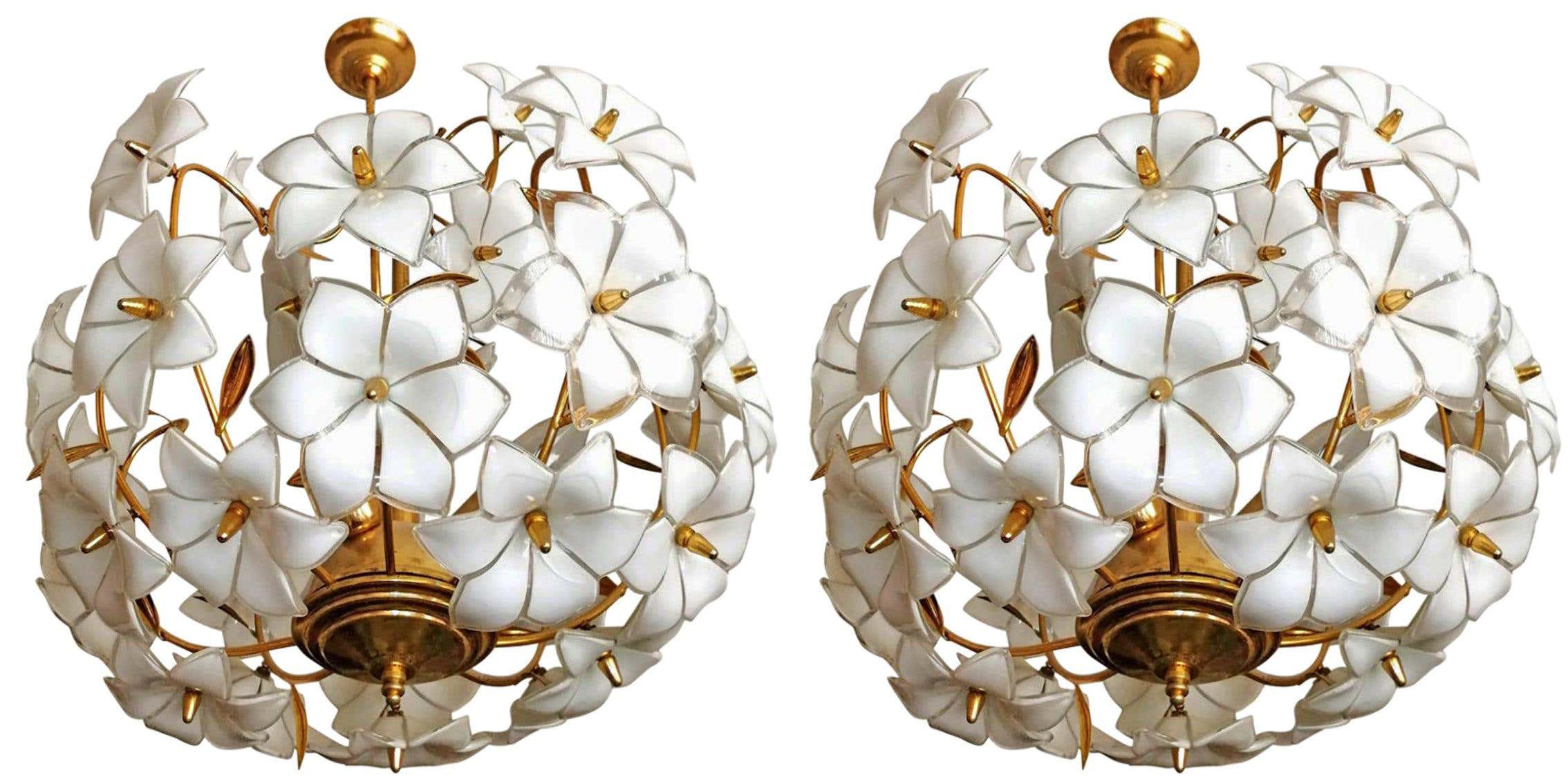 Italian Murano flower bouquet in the style of Venini art-glass with 36 hand-blow white and clear glass flowers and gold-plated brass. A few missing leaves. A pair available. 
Dimensions:
Diameter 20 in/ 50 cm
Height 32 in/ 80 cm
Weight: 18 lb/8