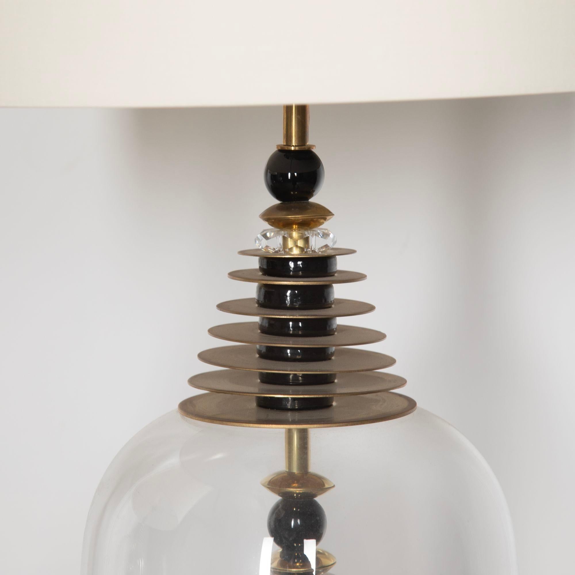 Fabulous contemporary table lamps made from Murano glass.With modern white lampshades, these are a stylish addition to any living space!This item has passed PAT testing according to UK standards.