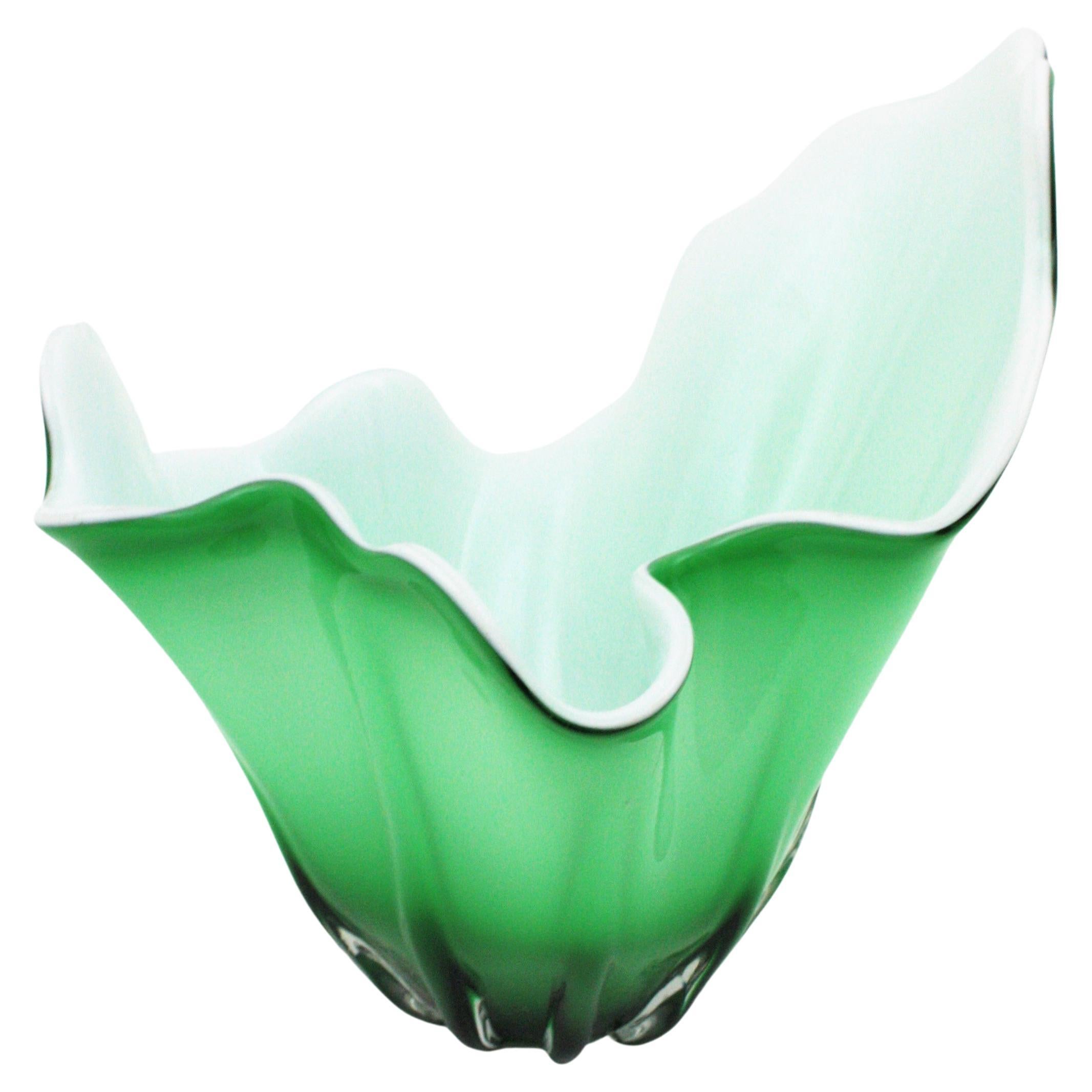 Eye-catching Sommerso Murano Glass Large Centerpiece Vase. Italy, 1960s.
This hand blown Murano glass vase is made with green glass submerged into clear glass at the exterior part and it has white glass at the interior part. Amazing fazzoletto