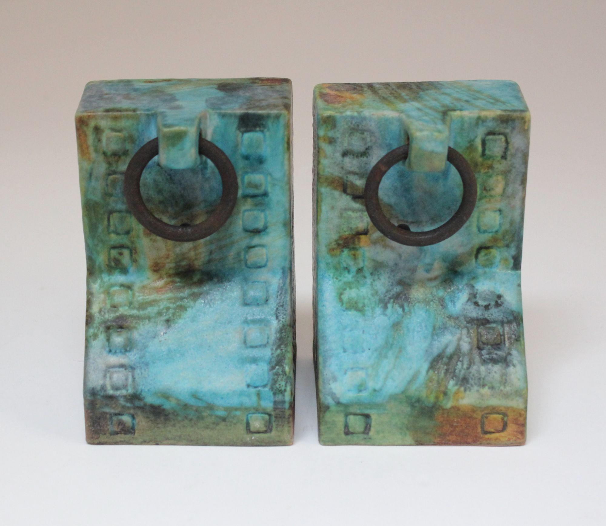 Ceramic bookends with decorative iron rings from the 