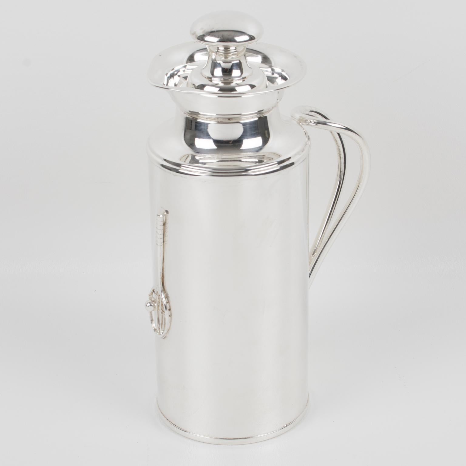 This streamlined Italian silver plate barware thermos or insulated decanter features a sleek and modernist design. The insulated carafe is made from silver plate metal. This bar accessory has a rounded shape ornate with double handles and a tennis