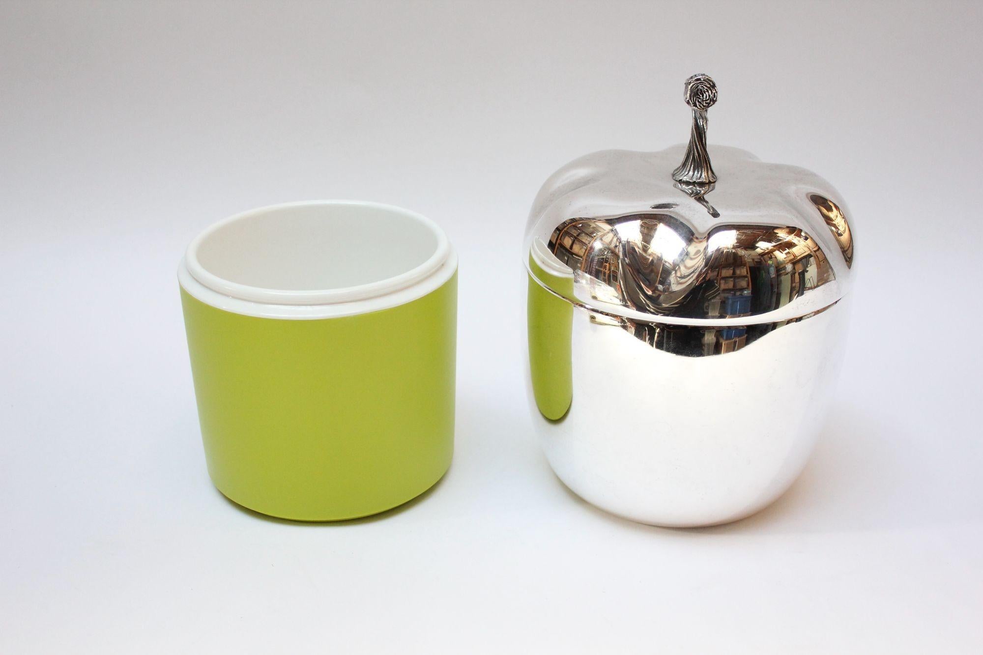 Charming Mid-Century Italian Modern ice bucket resembling both a bell pepper and an acorn with silver plate exterior and neon green plastic interior. 
Features a heavily textured, sculptural stem that serves as the handle for removing the top.