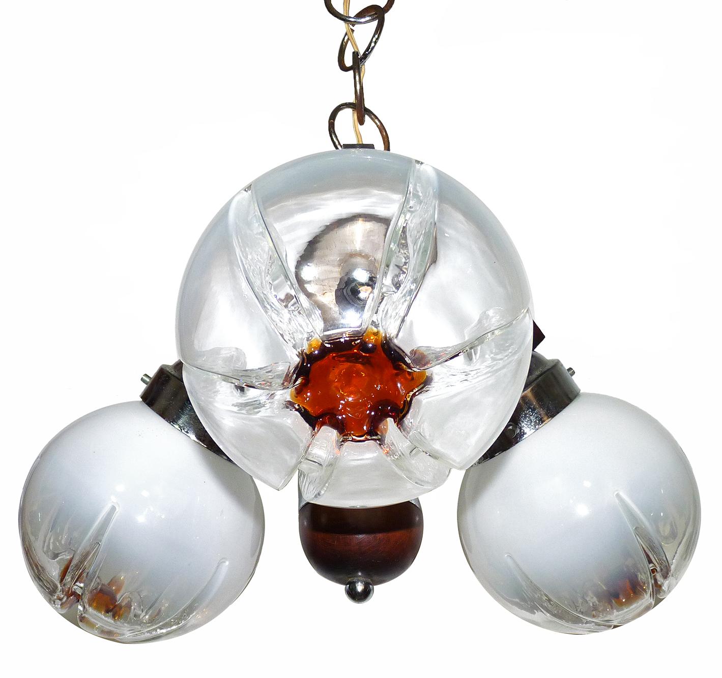 Vintage 1960s Italian modernist Murano Mazzega era art glass chrome chandelier
Measures:
Diameter 20 in / 50 cm
Height 29.5 in (15.7 in, chain)/ 75 cm (40 cm/chain)
Glass globe diameter 6.3 in / 16 cm
Weight 11 lb/ 5 Kg
3 light bulbs E14/ good