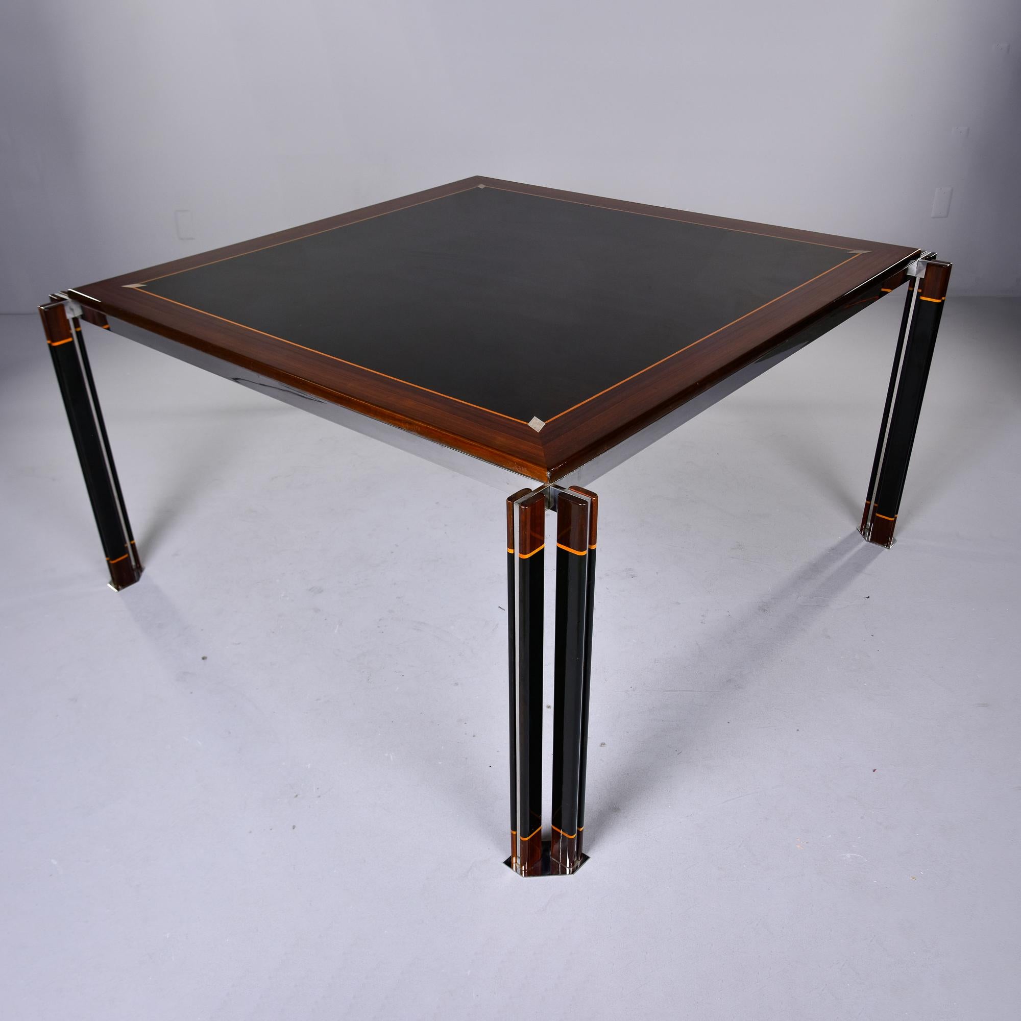 This circa 1970s dining table was designed by Paolo Barracchia and manufactured in Italy by Roman Deco. The table is 60.75” square and consists of padouk with an ebony center and contrasting geometric maple and bone inlays. The table top has a band