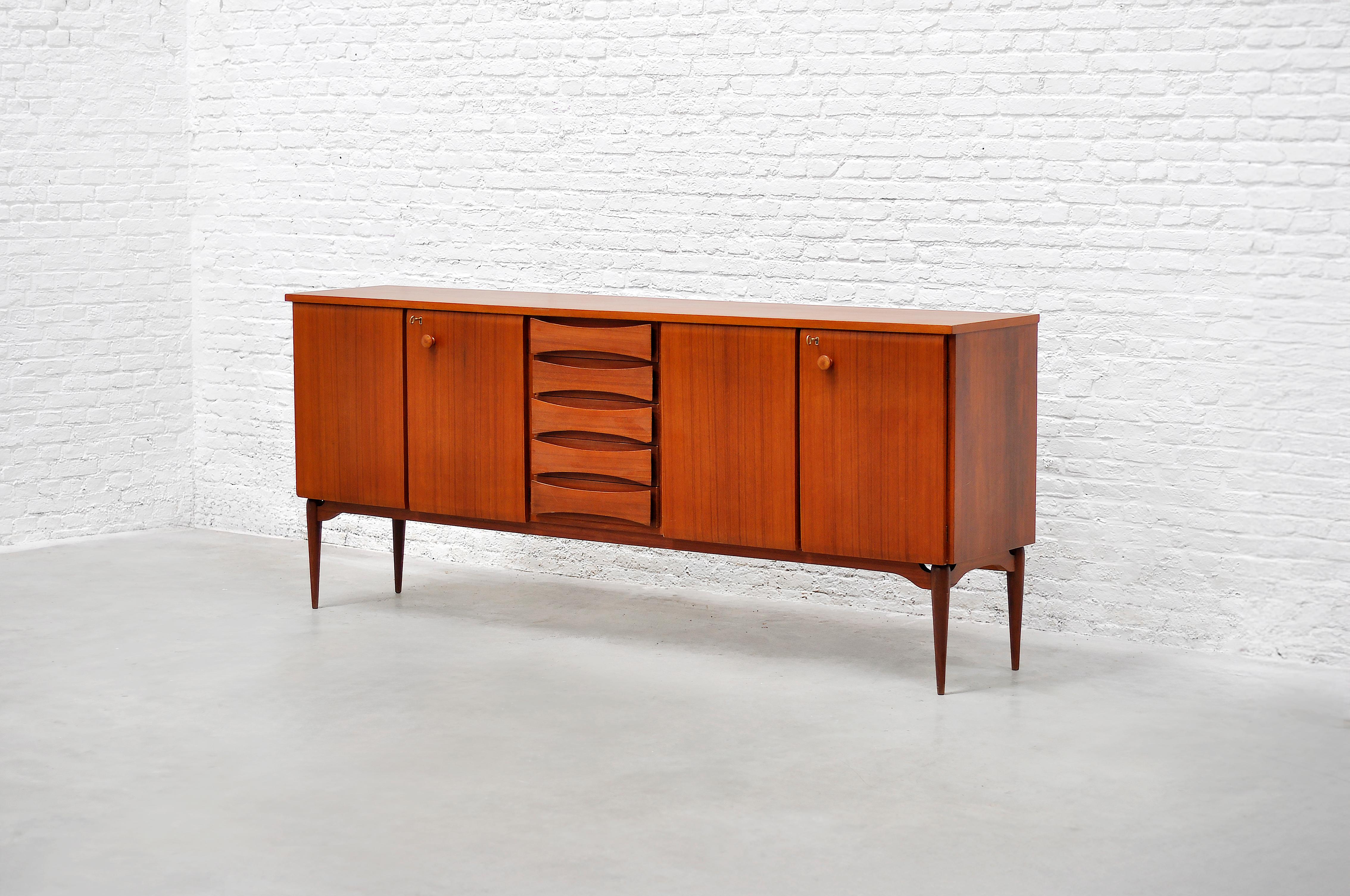 Beautifully constructed Italian modernist sideboard, designed and produced in 1960s. This piece is attributed to Vittorio Dassi. Crafted from fine grain teak showcasing beautiful warm tones and rich colours throughout typical for Italian modernist