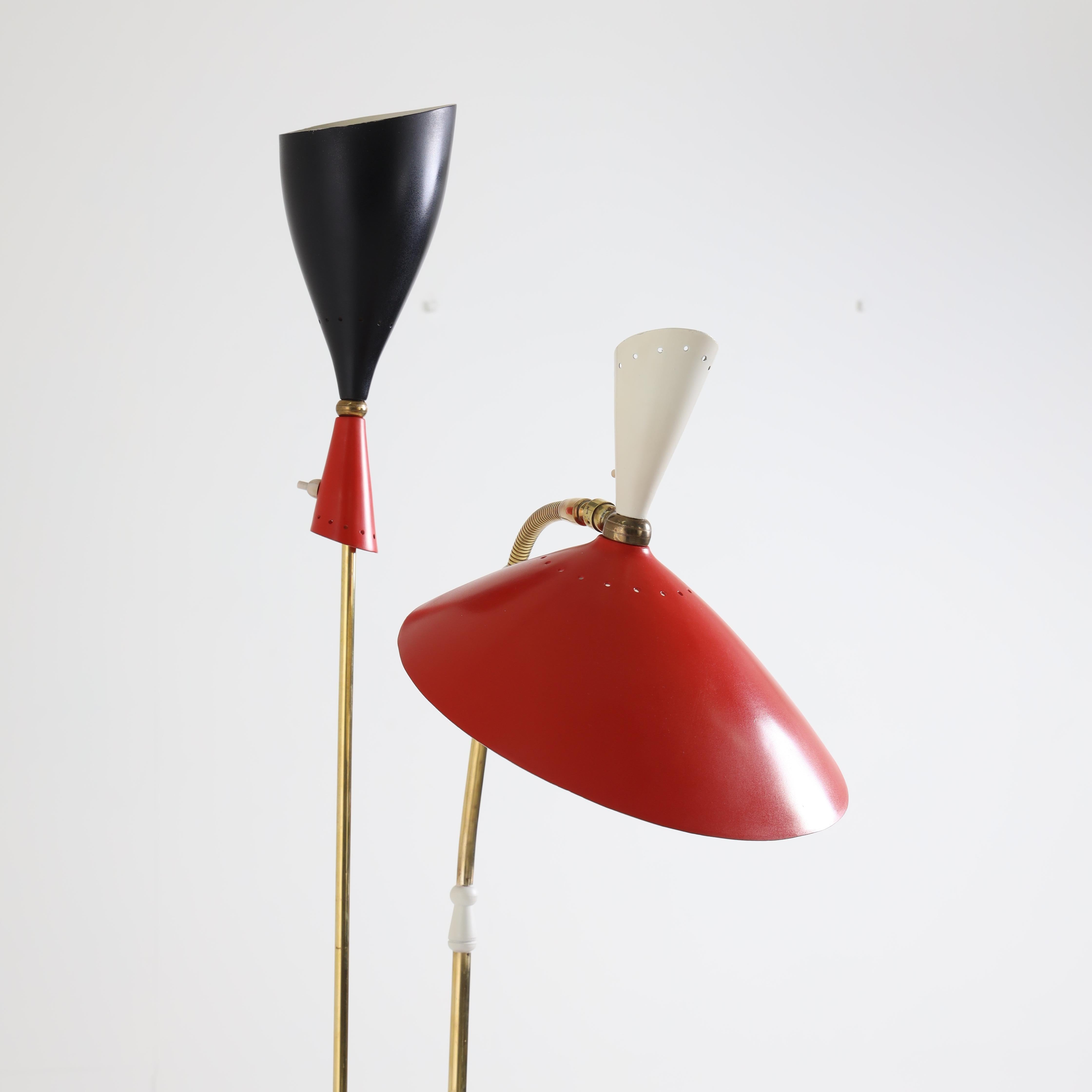 Italian modernist floor lamp. 
Patinated brass, marble base, red and black enameled shades.

 