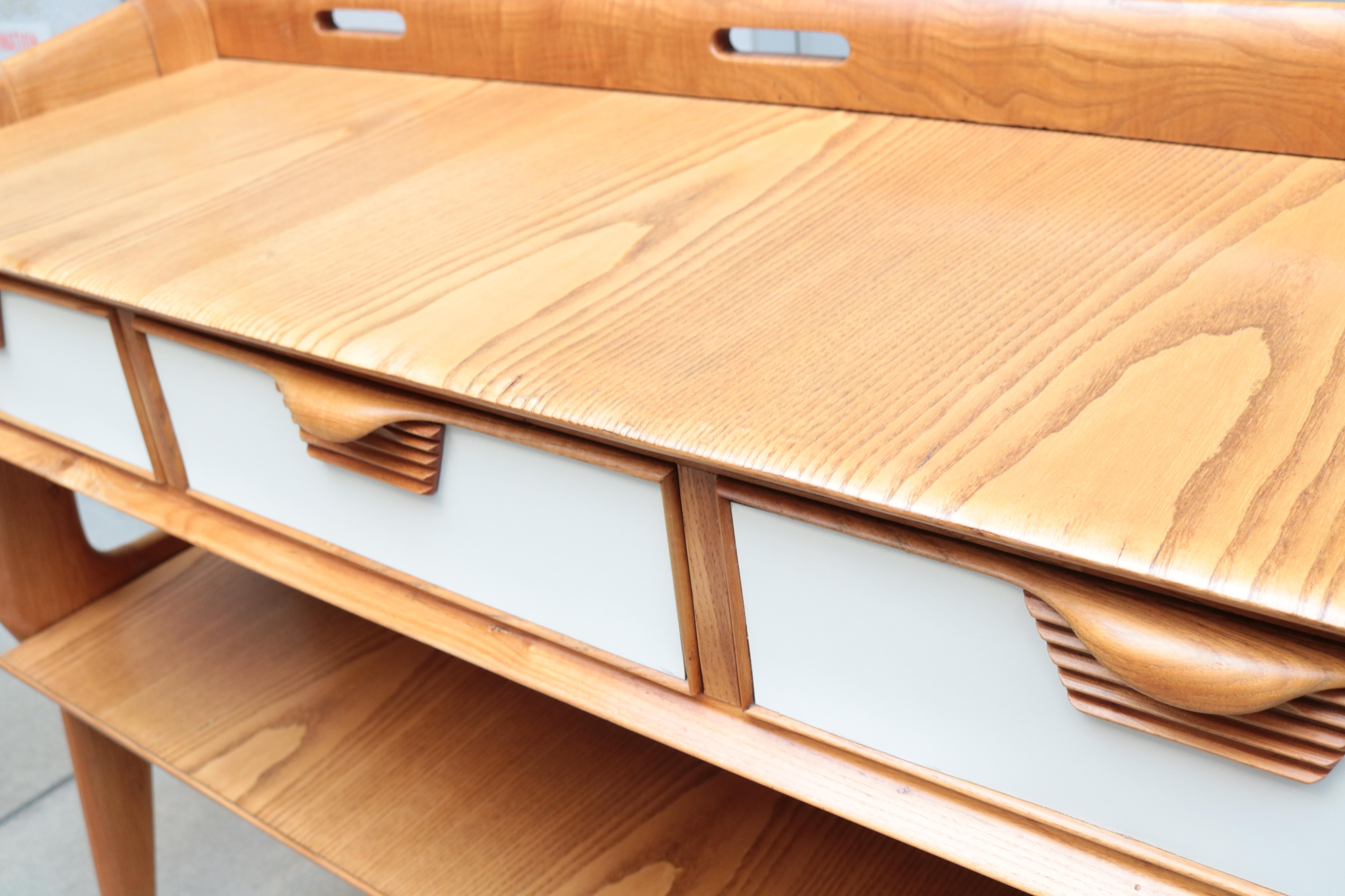 Italian Modernist two-tier console. 
Oak with laminate faced drawers.