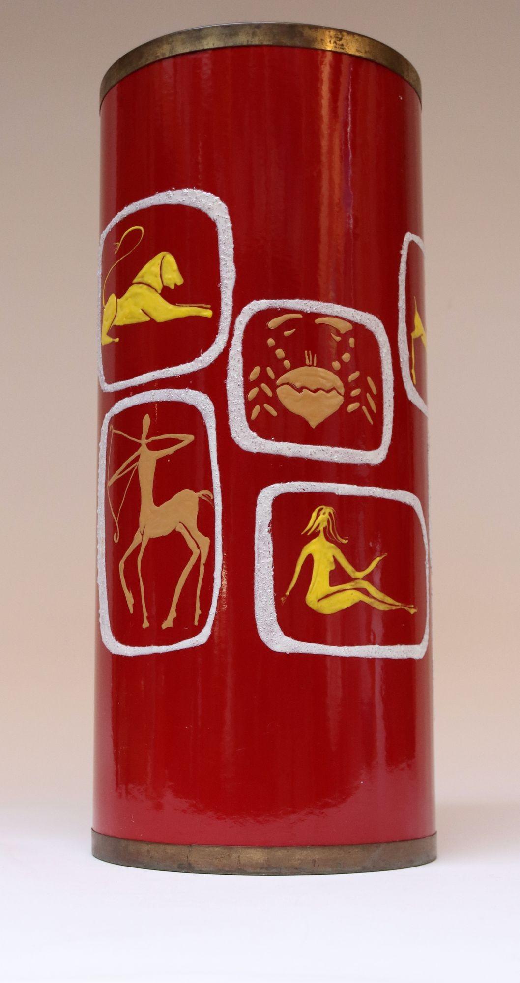 Giuseppe Calonaci, b. 1931 Poggibonsi (Sienna) Italy, founded S.I.V.A. in 1955, an arts laboratory focused the creation of enamel on steel/metal art and sculptural objects. This umbrella stand/wastebasket in red enameled metal with brass banding is