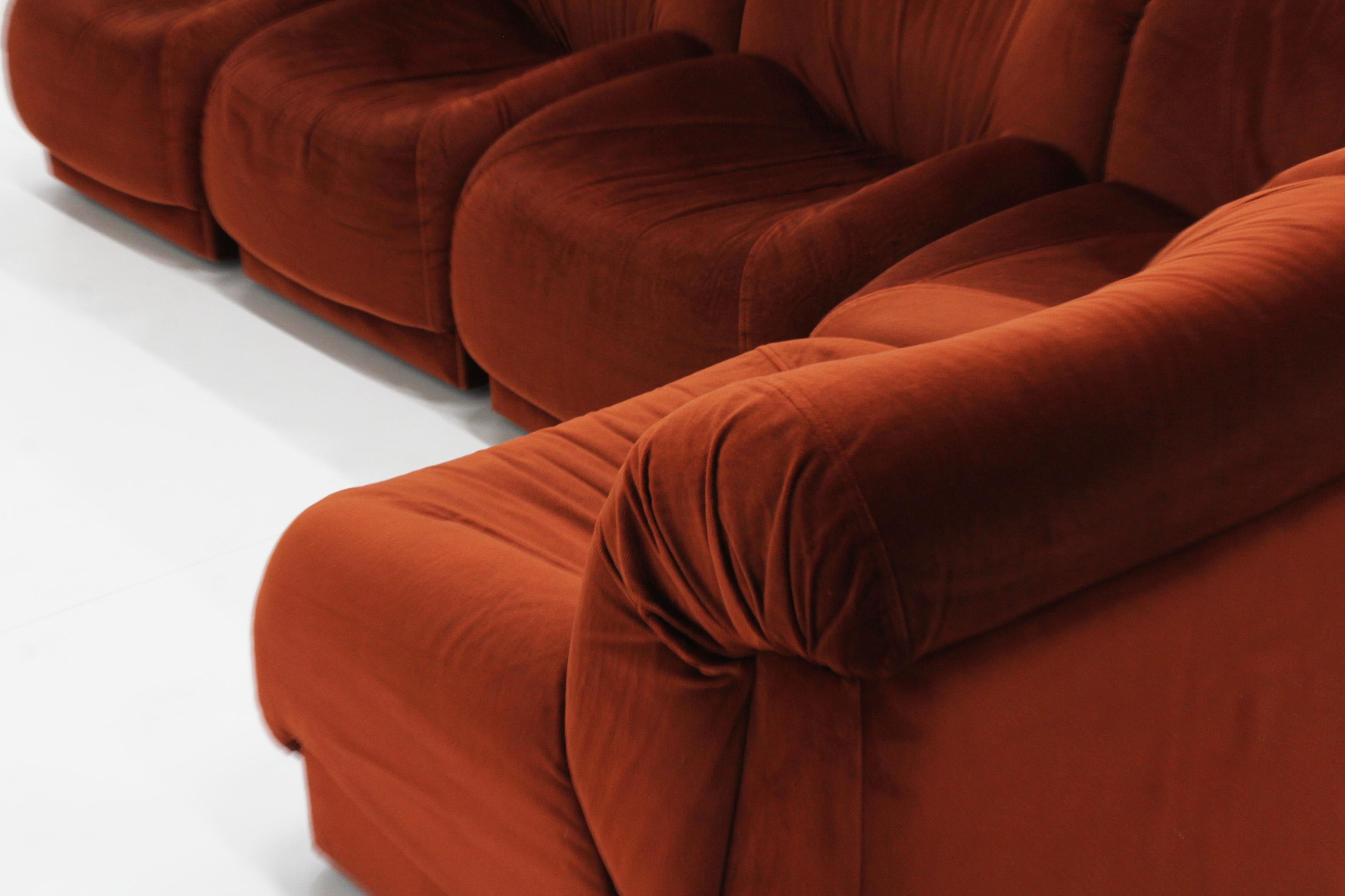 Italian modular sofa Doimo Salotti, 1970s.

Italian modular sofa from the 1970s designed by Doimo Salotti. 5 modular elements with corner piece. Beautiful dark orange velvet fabric, original upholstery.  Plastic base.

Good condition, with minor