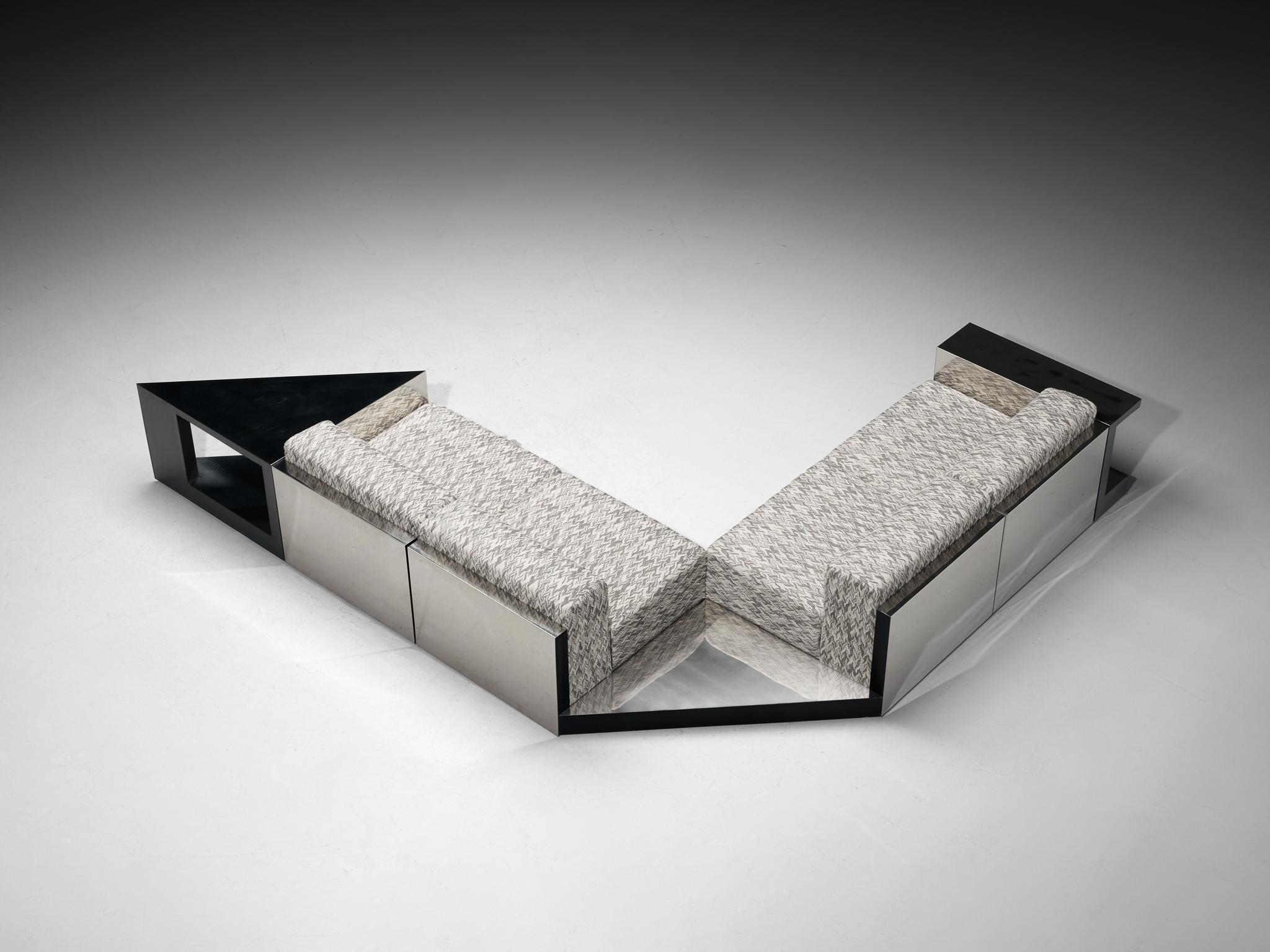 Modular sofa, fabric, metal, wood, Italy, 1970s

This beautiful Italian sectional sofa showcases the bold and eccentric design choices of the 1970s, highlighted by its striking upholstery with a dynamic patterned fabric. The modular design features