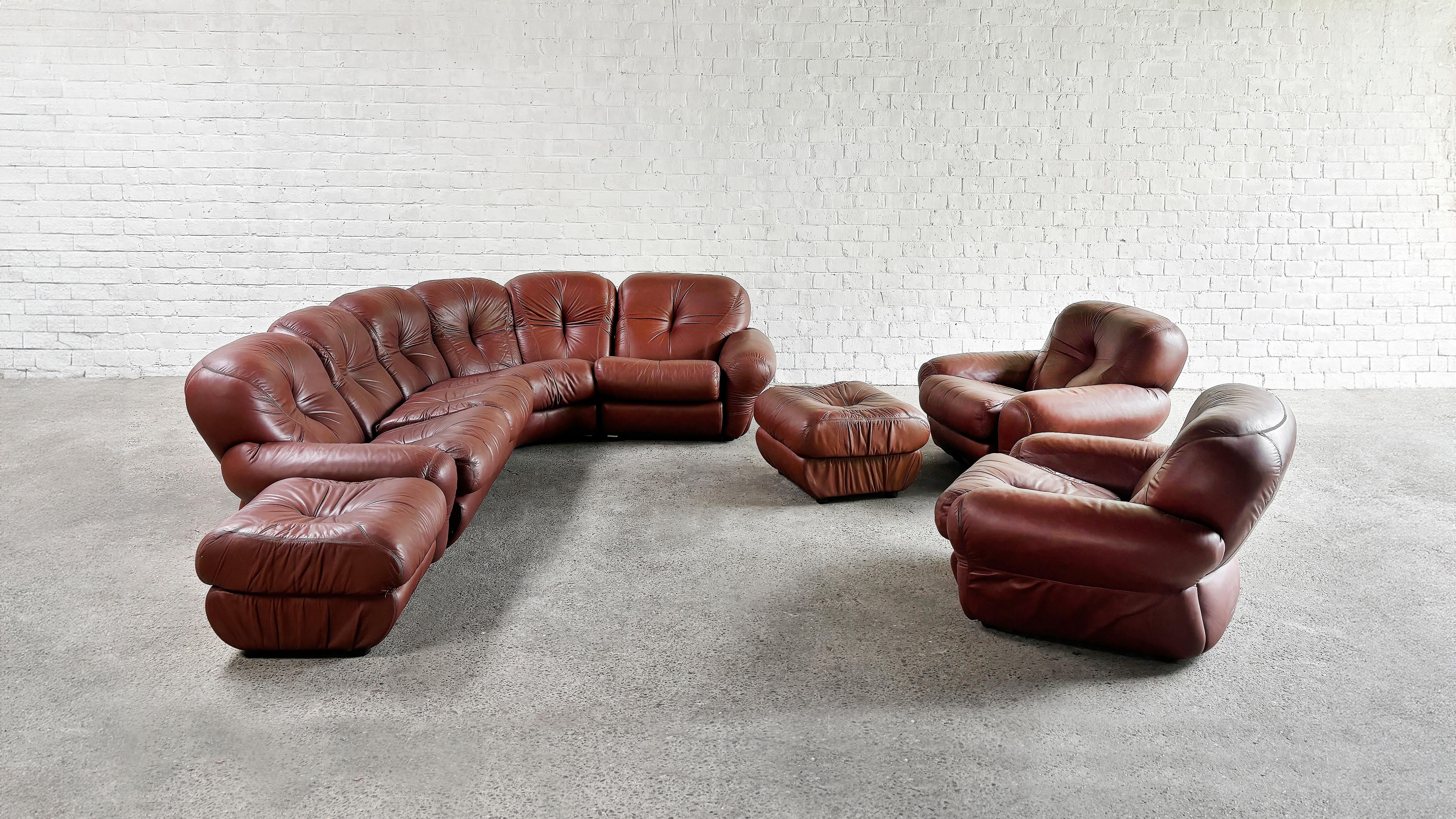 A large Italian modular sofa consisting of eight individual big and fluffy pieces. This sofa was made is the 1970’s and sits extremely comfortable. Its rounded lines and shapes lend a softened aesthetic typical of 1970s Italian modernism, creating