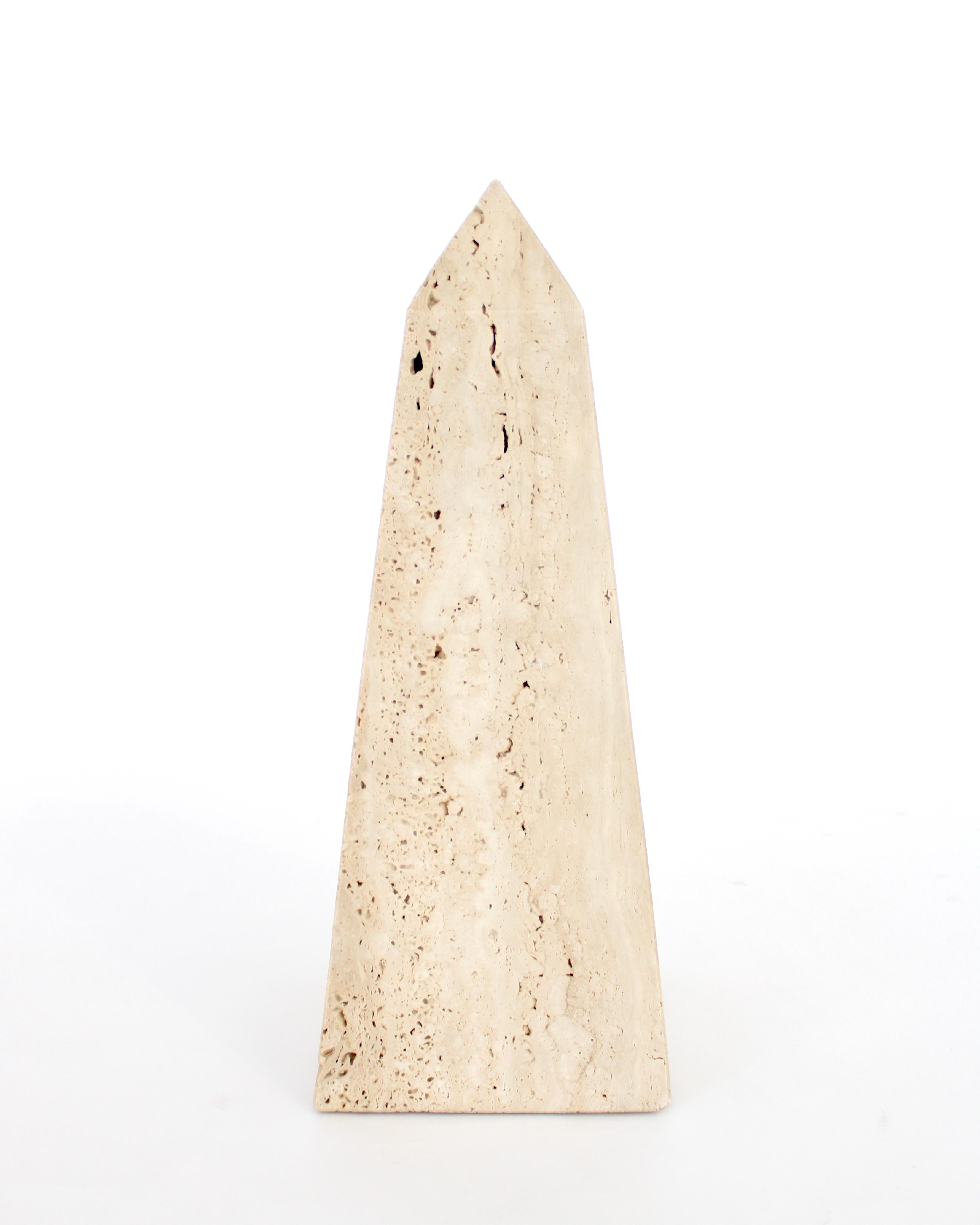 A monumental Italian Travertine decorative obelisk for Raymor.
No chips, lovely cream travertine. Labels intact. Made in Italy. Raymor. 
Overall size: 6