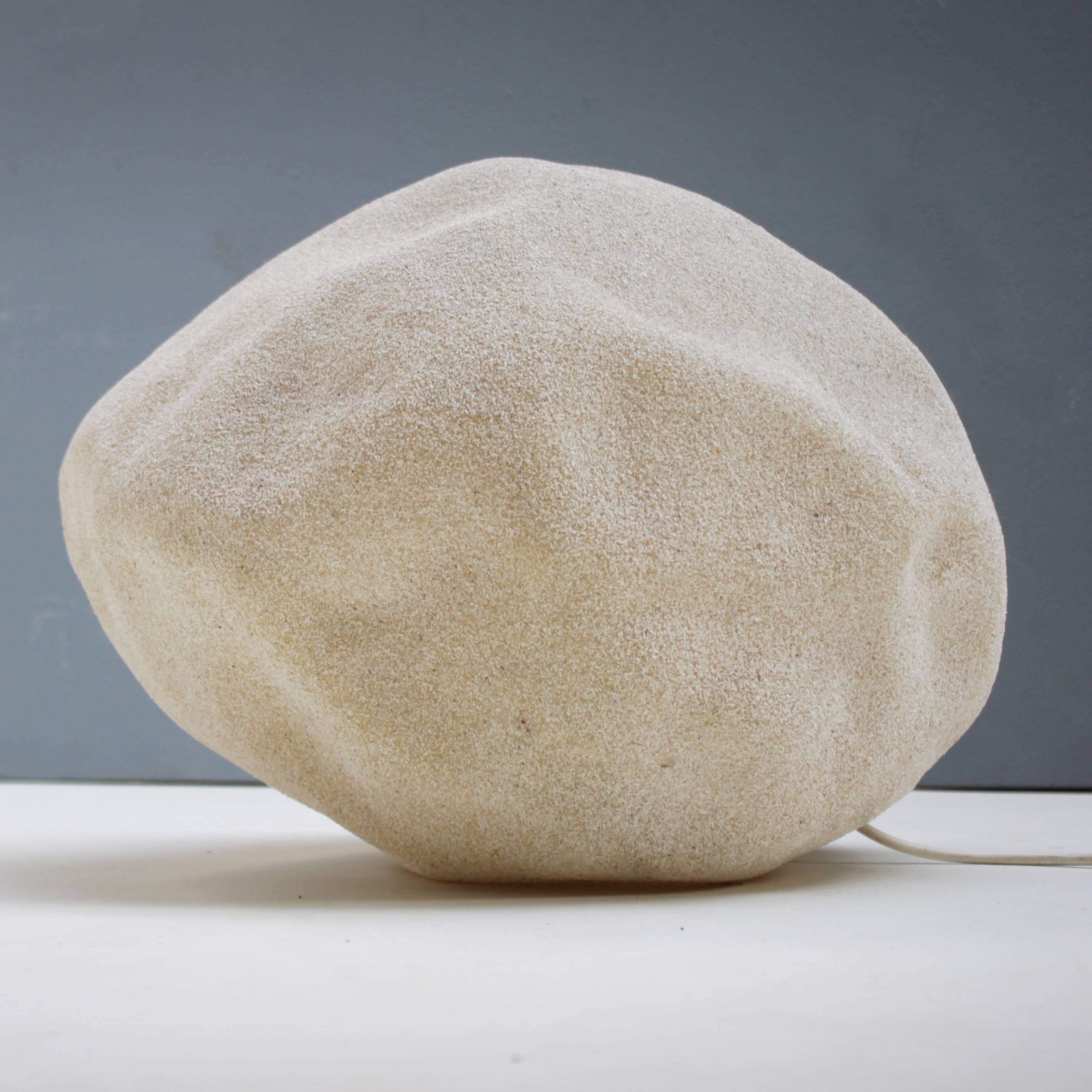 The 'Moon Rock Light' inspired by the Apollo 11 moon landing in 1969 and the lighting stones 'Dora' by André Cazenave. Manufactured by Singleton in Italy. Translucent polyester with marble powder inclusions. Marked. One bulb E27/E26 of max 40 watt,