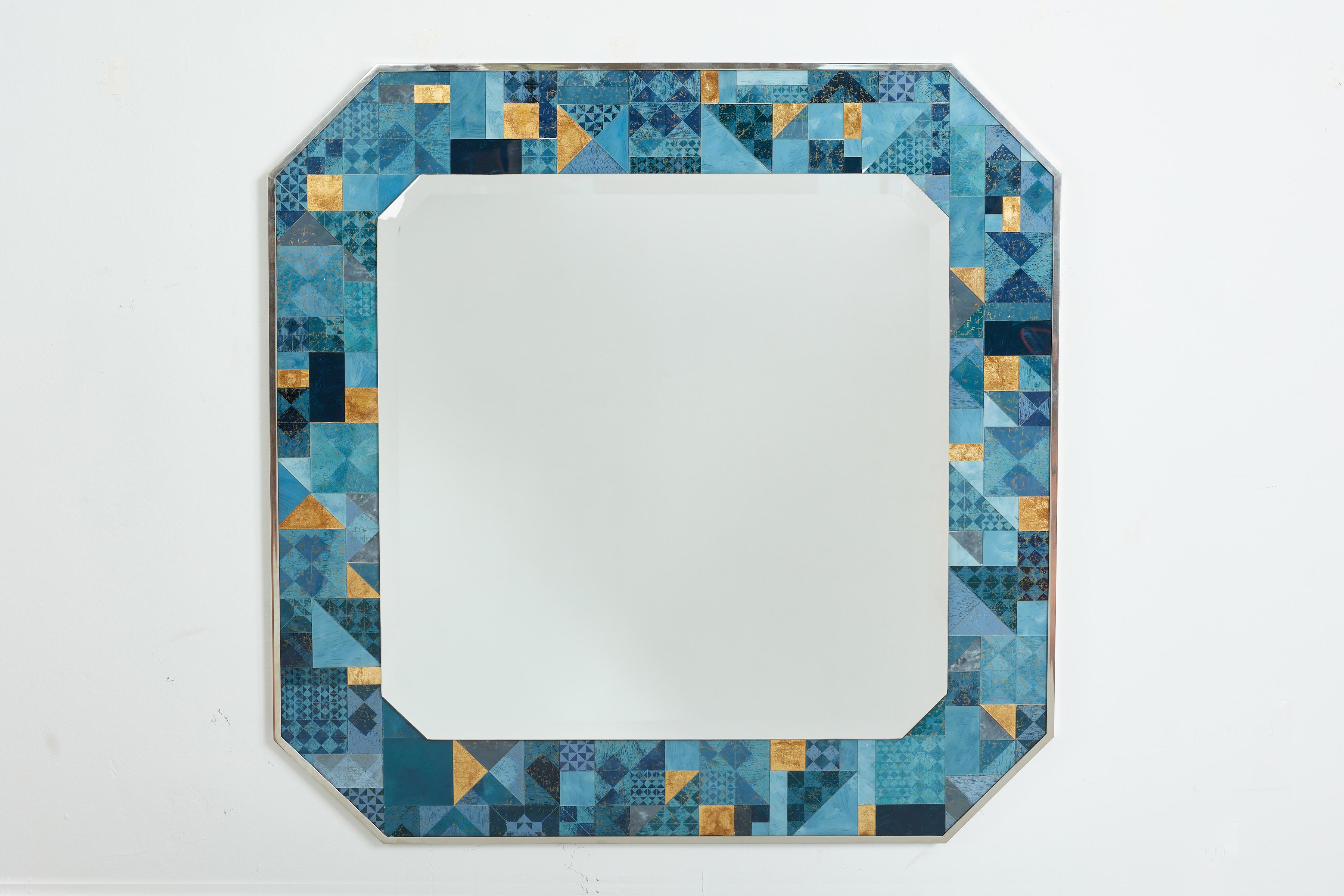 Italian wall mirror by Gallotti and Radice 
Italy, 1980s
Large in scale - 
Octagonal shape with chrome frame and geometric patterned glass decorated in different triangular shapes and shades of blue and gold. 
Original label attached - signed 1984


