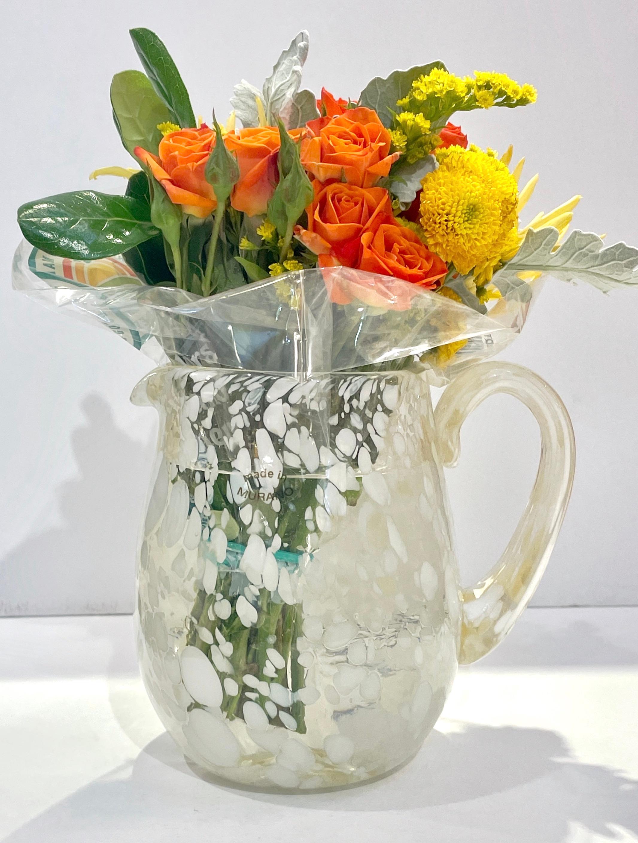 Venetian Handblown jug vase in clear blown Murano glass, interestingly decorated like a modern painting that resembles a Monet Lily painting with an exquisite composition of white Murrine floating in the crystal glass with touches of golden amber