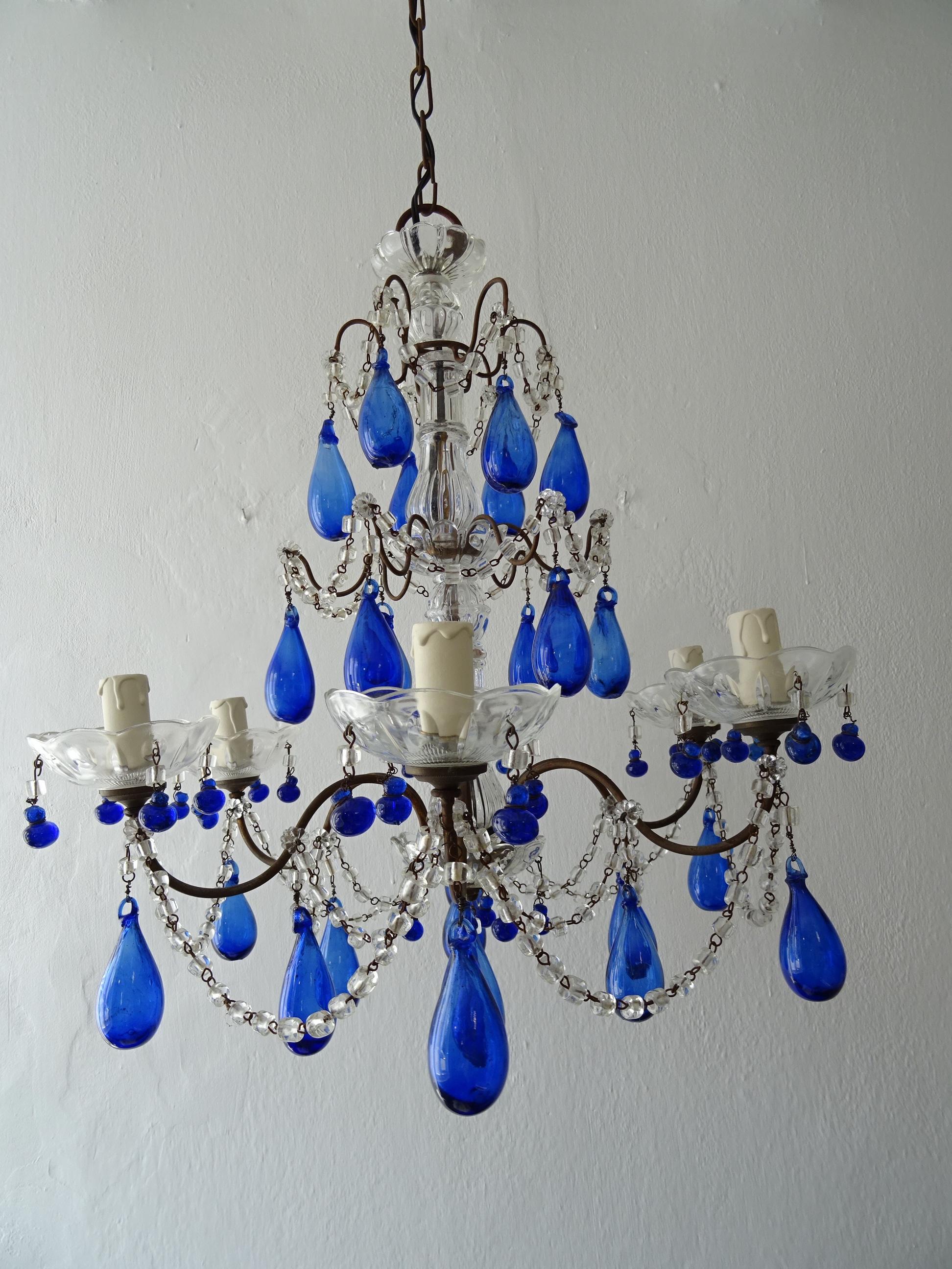 Housing 6 lights, sitting in crystal bobeches, dripping with vintage cobalt Murano glass tiny drops. This chandelier will be rewired with certified UL US sockets for the United States and appropriate sockets for all other countries and ready to