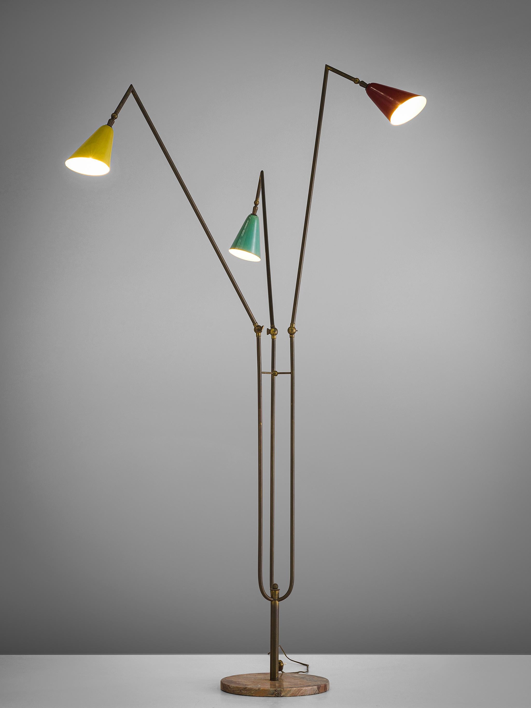 Floor lamp with colored shades in green, yellow and red metal, brass and marble, Italy, 1950s.

This floor lamp is built up of one pedestal pink marble foot from which one brass stem arises that sprout into three arms. The arms each end in a metal