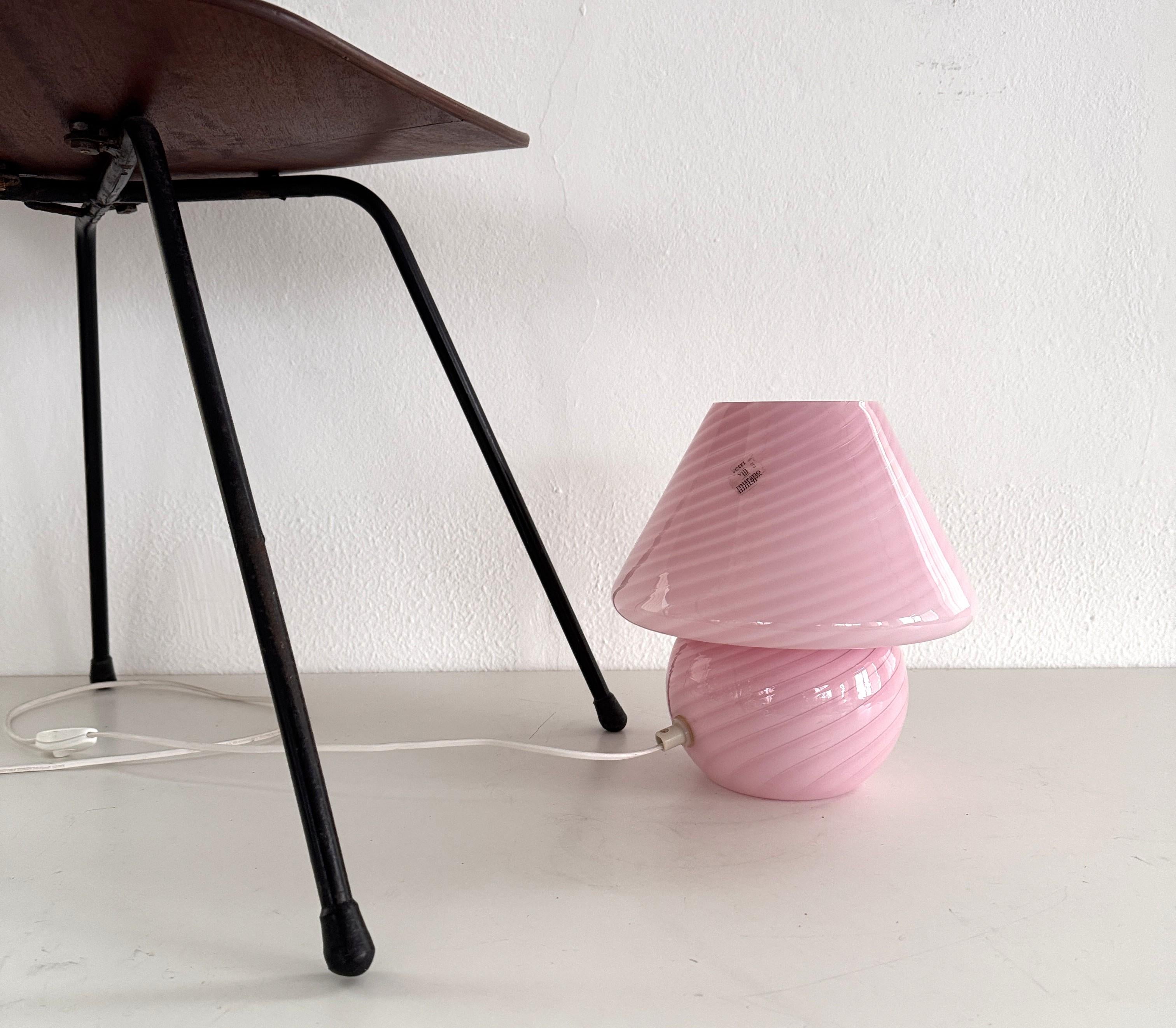 Italian Murano 70s Mushroom Table Lamp in Pink Swirl Glass

Original Italian vintage Murano mushroom table lamp in amazing pink - bubble gum color in swirl technique.
The lamp is hand-blown in one piece of glass with a swirl and makes a really cozy