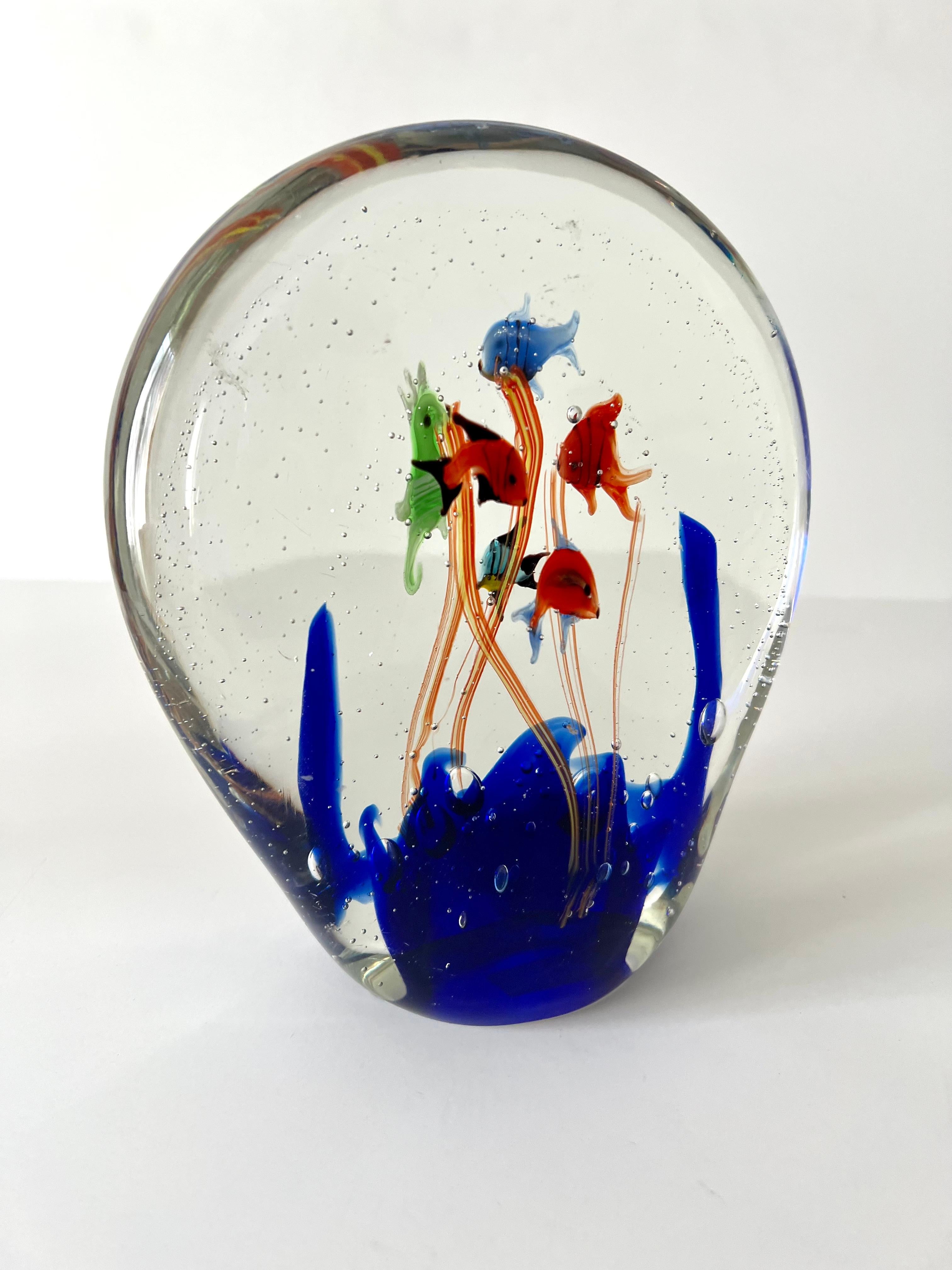 Very unique and rare shape Murano Paper Weight depicting a ocean scene or an aquarium - with fish, ocean plants and bubbles in all the right places... a wonderfully animated and decorative piece. A nice paperweight or decorative piece on any shelf -