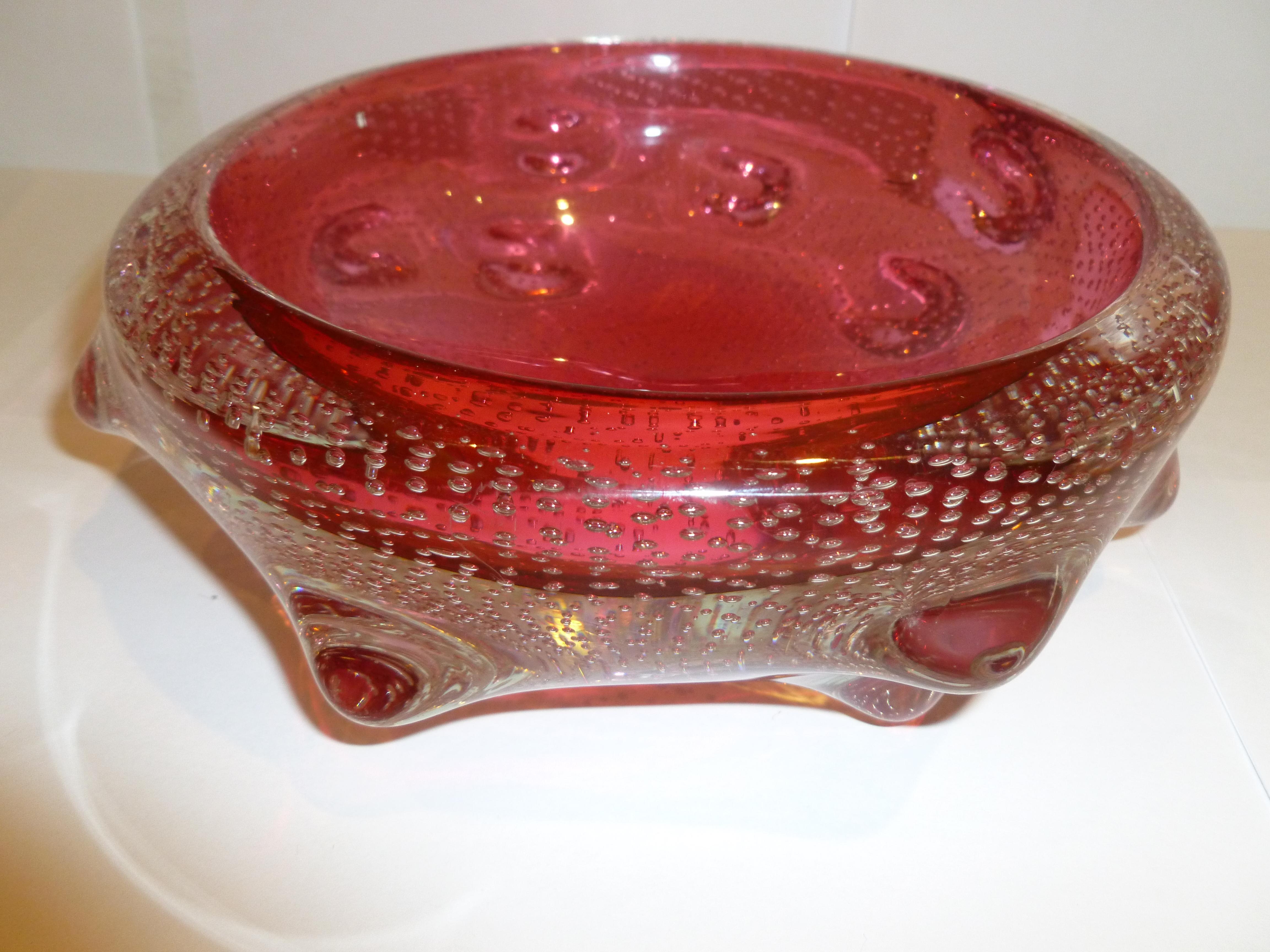 This gorgeous stunning cranberry pink Italian Murano Archimede Seguso glass bowl has hundreds of controlled bubbles called bullecante with lobes of nipple like appendages in the surround. It is a great size for use as a serving piece of a beautiful