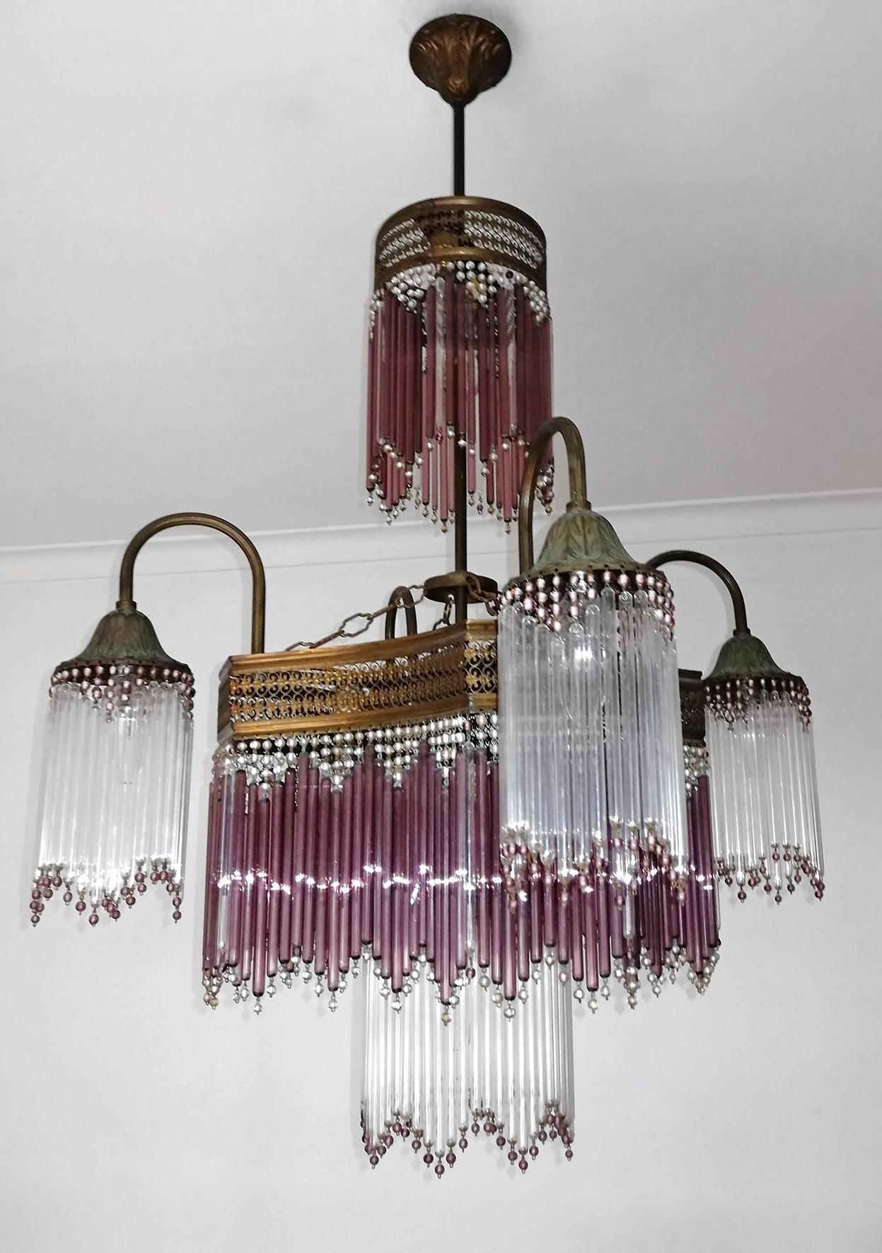 Fabulous midcentury chandelier in clear and pink purple glass and beads.
Measures:
Diameter 24 in/ 60 cm
Height 36 in/ 90 cm
7-light bulbs E14/ good working condition.
Age patina.
Assembly required. Bulbs not included.