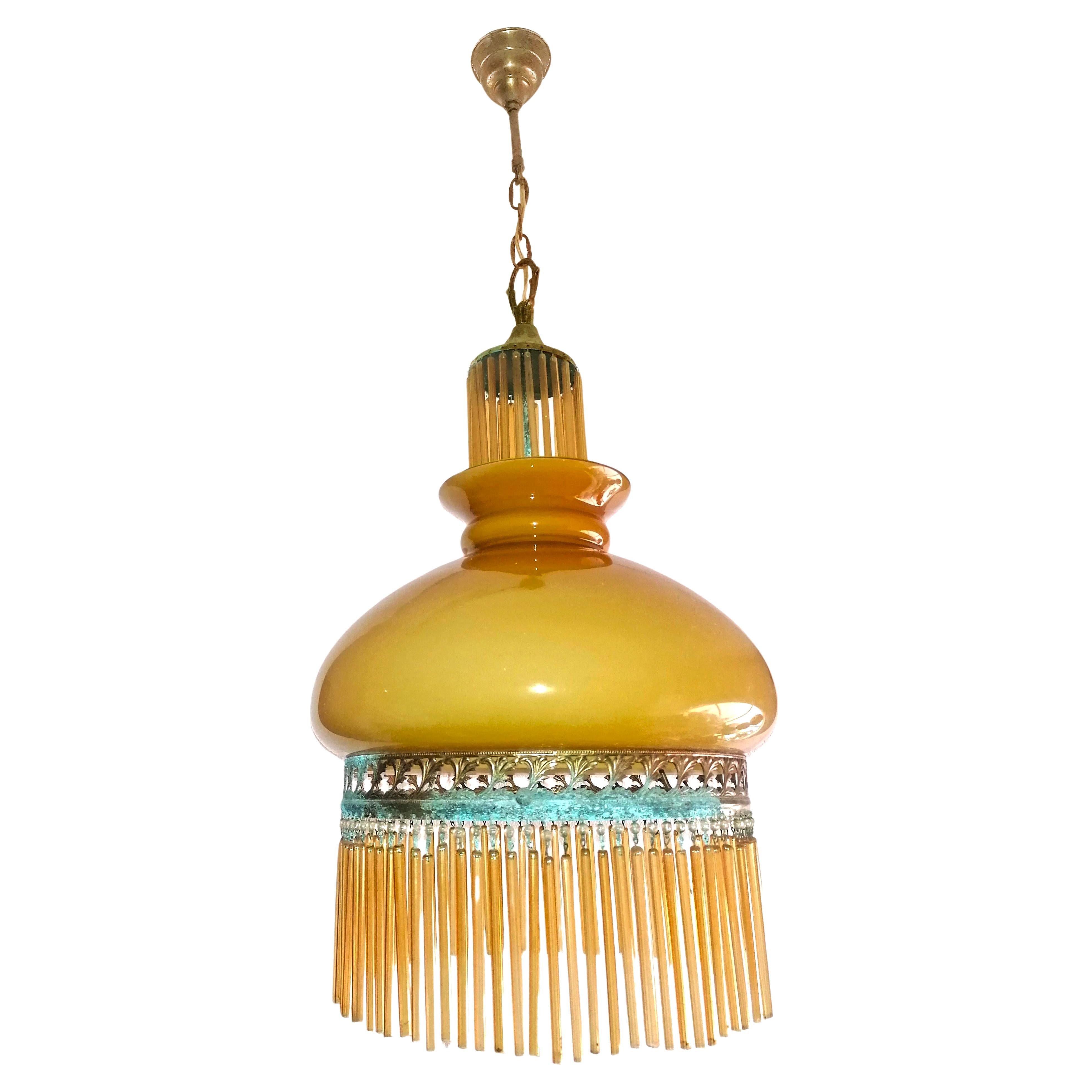 Beautiful Italian midcentury chandelier with Amber Glass & Beaded Glass Fringe in the style of Art Deco and Art Nouveau. Beautiful age patina. 

Dimentions:
Height 31.5 in. (chain/4 in)/ 80 cm (chain/10 cm)
Diameter 14.18 in. (36 cm)   
One light