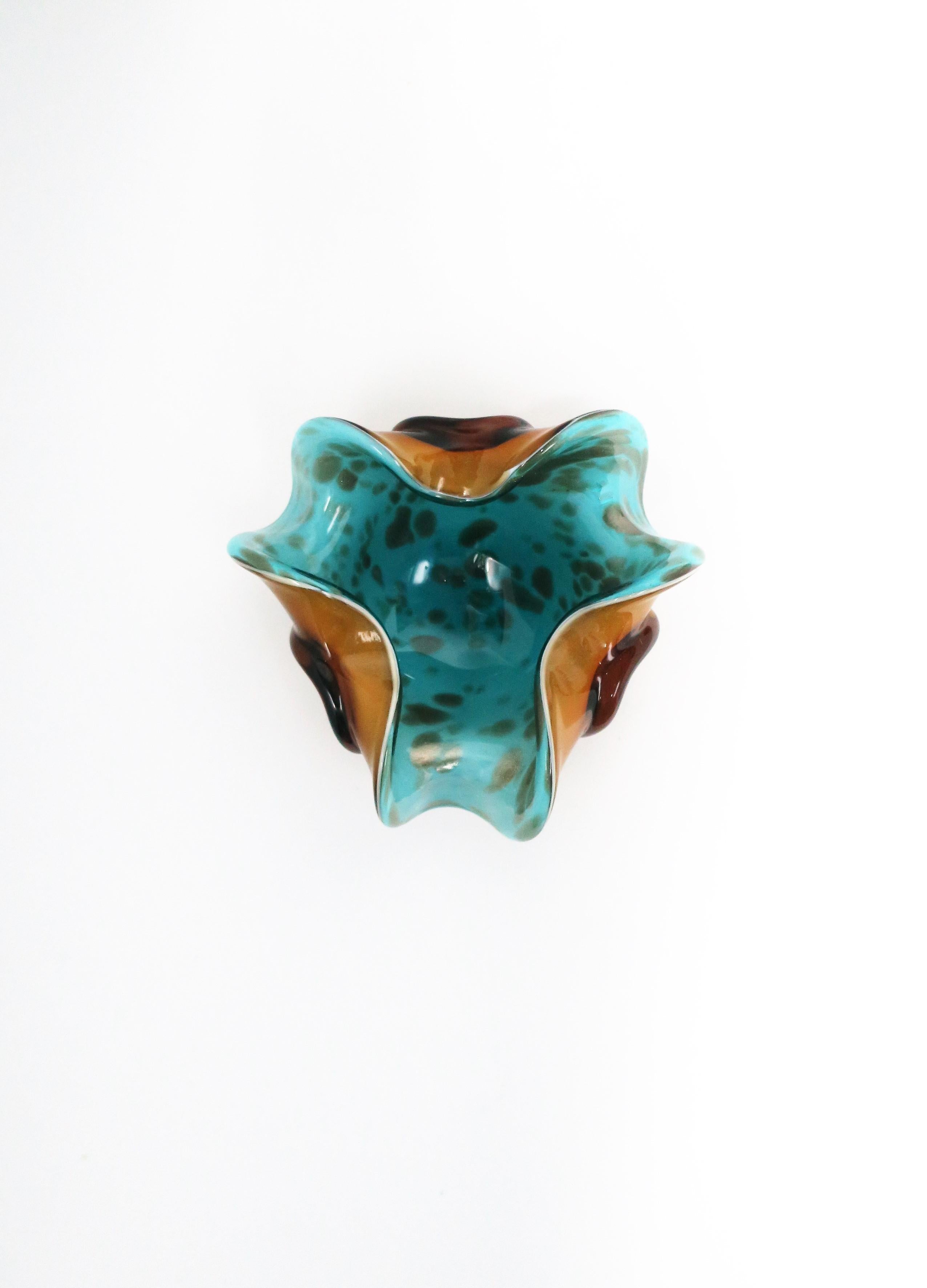 A beautiful and substantial mid-20th century Italian Murano turquoise blue, shimmering gold/copper, and amber colored art glass bowl, 1960s, Italy. Bowls' dimensions: 6.75