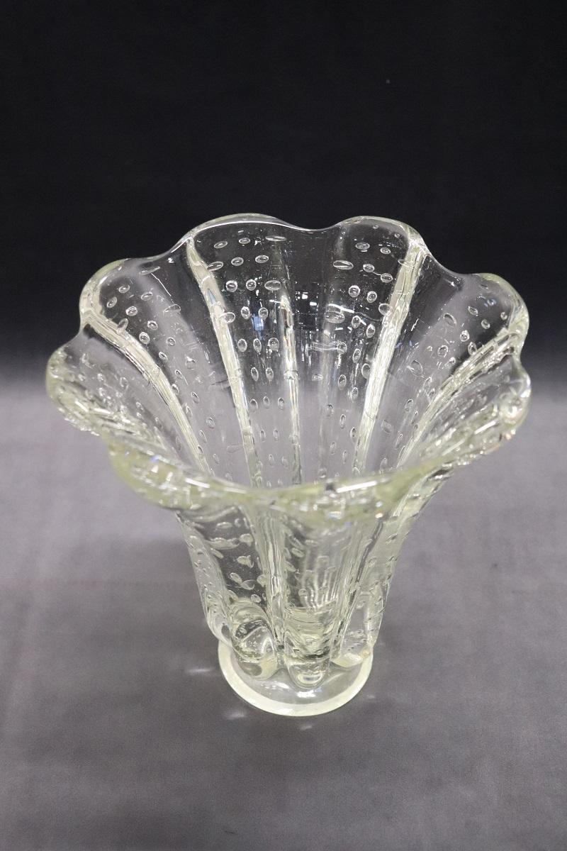 Beautiful Italian desgn mid-century murano art glass transparent vase. This model vase designed by Ercole Barovier (Murano, Italy, 1950s).  A stunning little vase made with a distinctive Barovier vase technique called “bullicante,” which involves