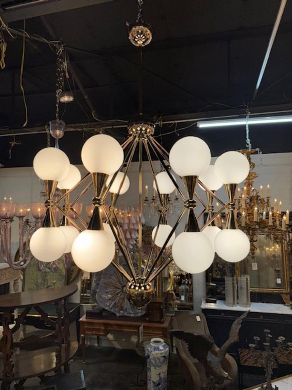 Modern large scale Italian Murano glass and polished brass atom chandelier. Sure to make a statement! 54H x 36W