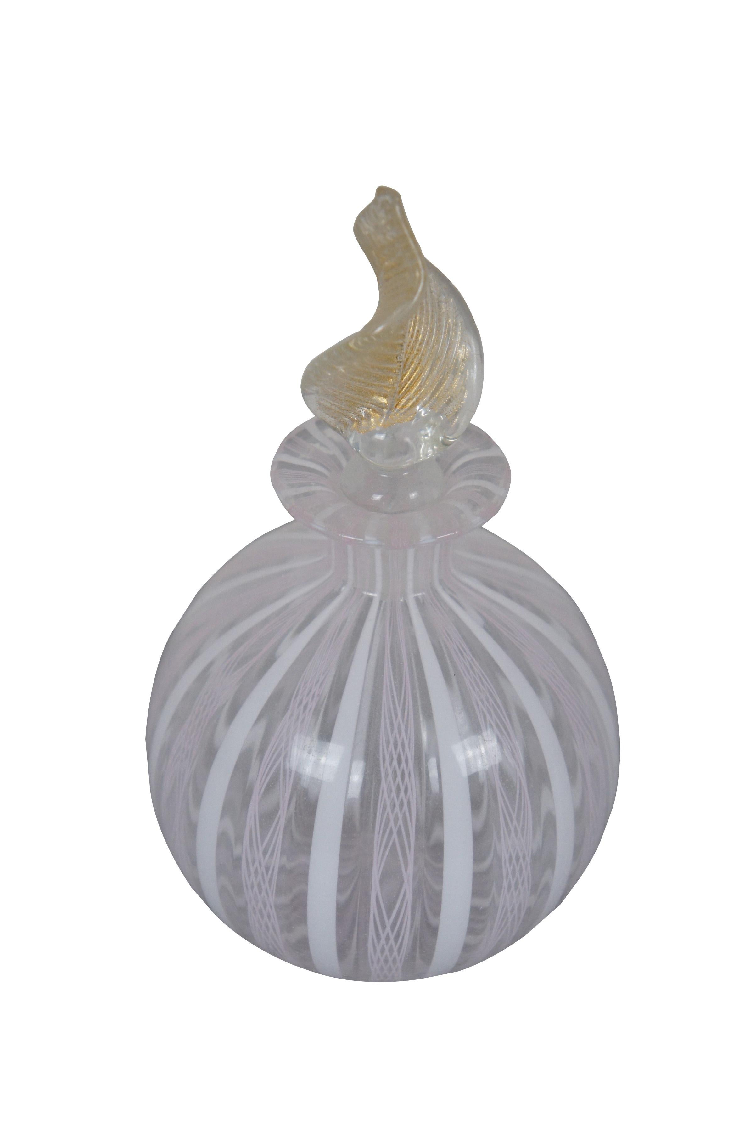 Mid 20th century Murano hand blown art glass perfume bottle featuring a round form decorated with vertical pink and white latticino stripes and a gold flecked leaf shaped stopper. 

Dimensions:
3.25