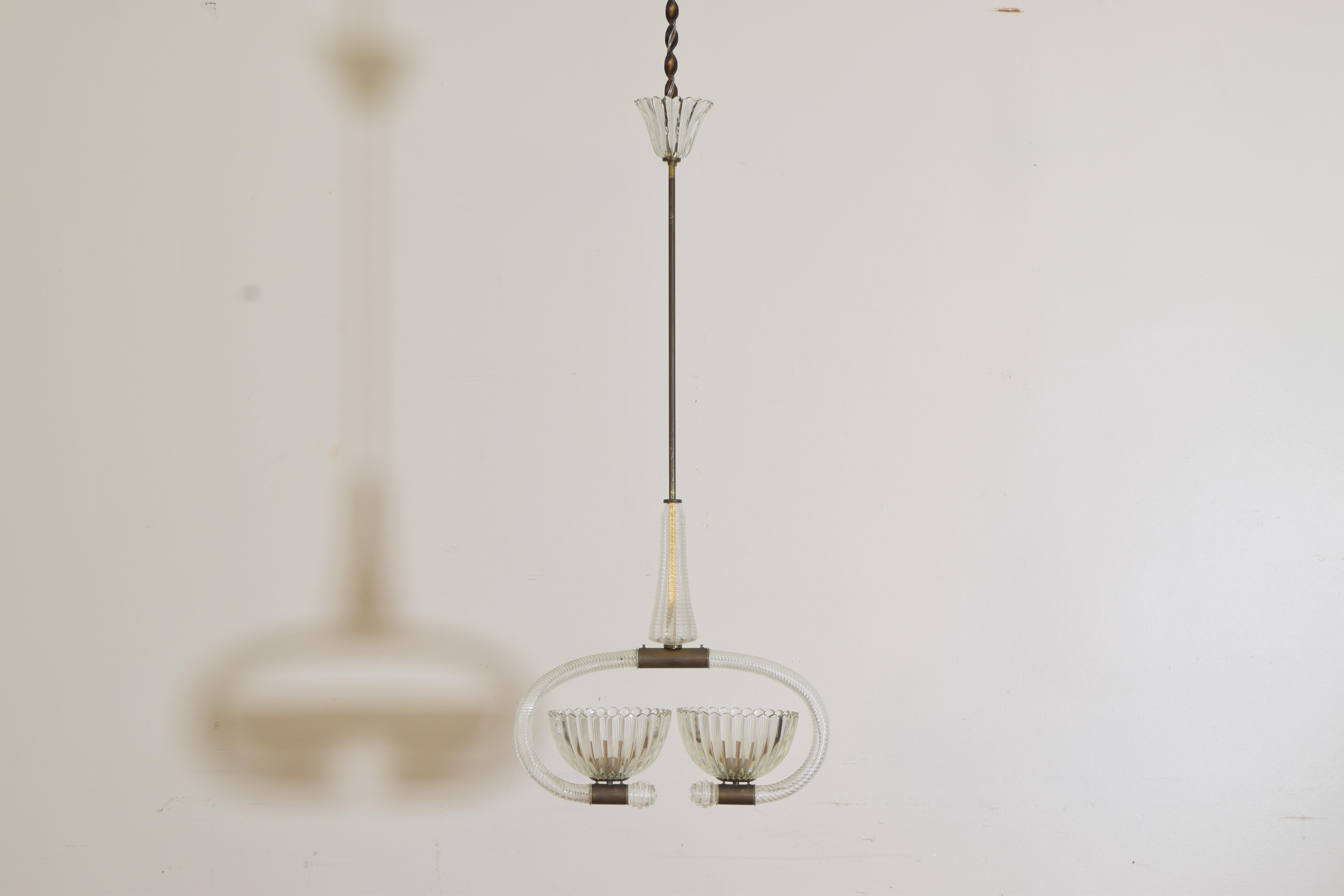 suspended from its original glass canopy and brass rod this fixture features two large glass bobeches within and under elliptically shaped arms, all fittings are in brass, internally wired 