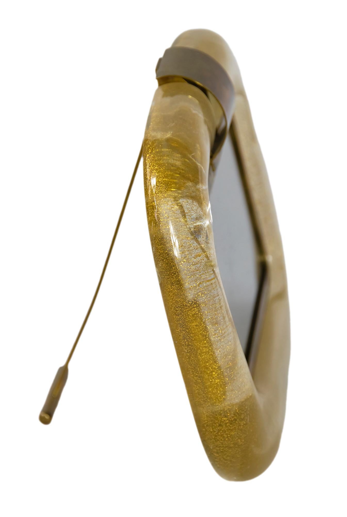 Italian Murano blown glass and brass photo frame by Tommaso Barbi from 1960's.
The glass is handmade, blown, transparent with gold dust and spiral facture inside.
Signed Tommaso Barbi made in Italy.
  