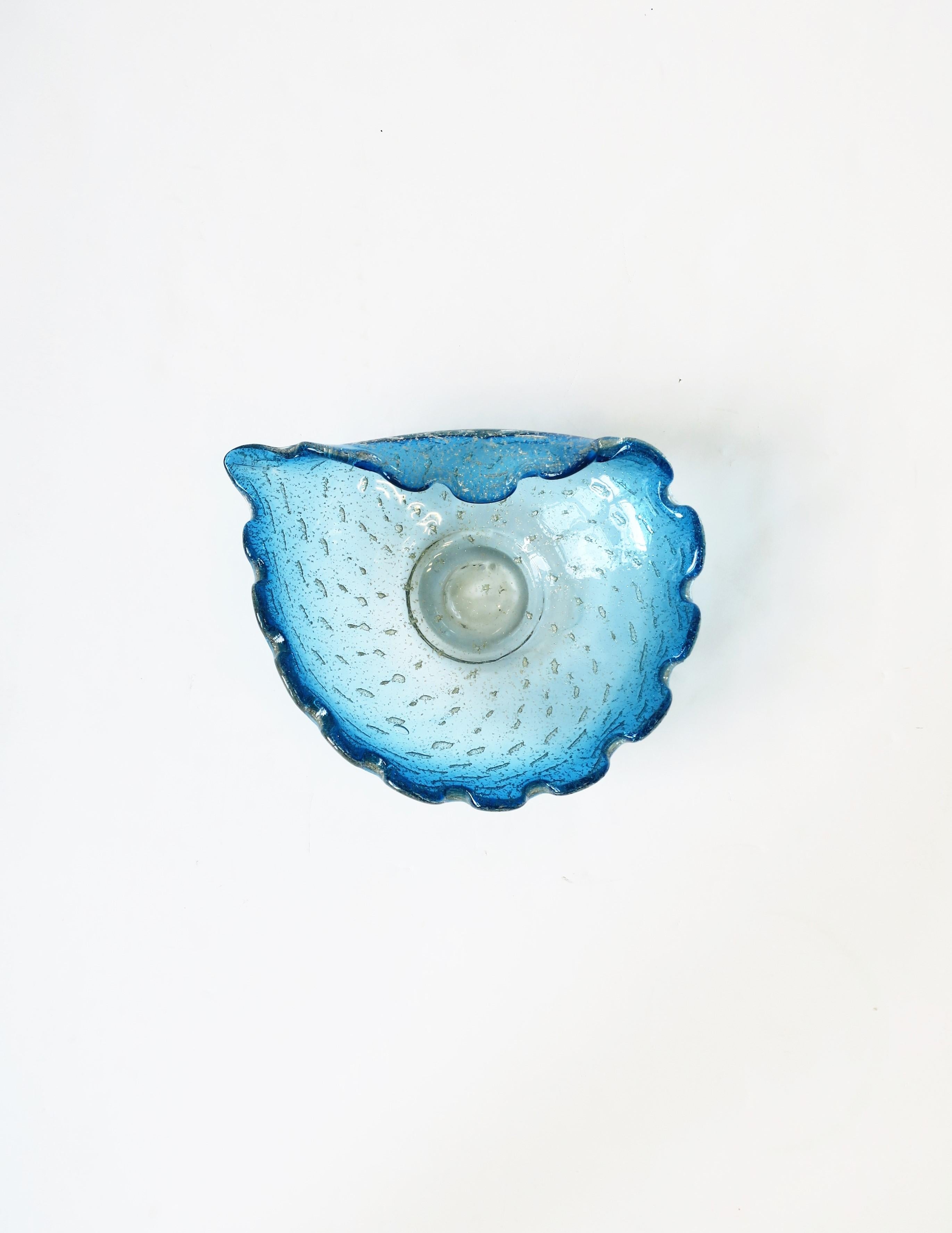 A beautiful Italian Murano blue and silver art glass bowl with asymmetric design and scallop edge, circa mid-20th century, Italy. Bowl is blue and silver with a controlled bubble design, in the style of Italian designer Alfredo Barbini, circa 1960s,