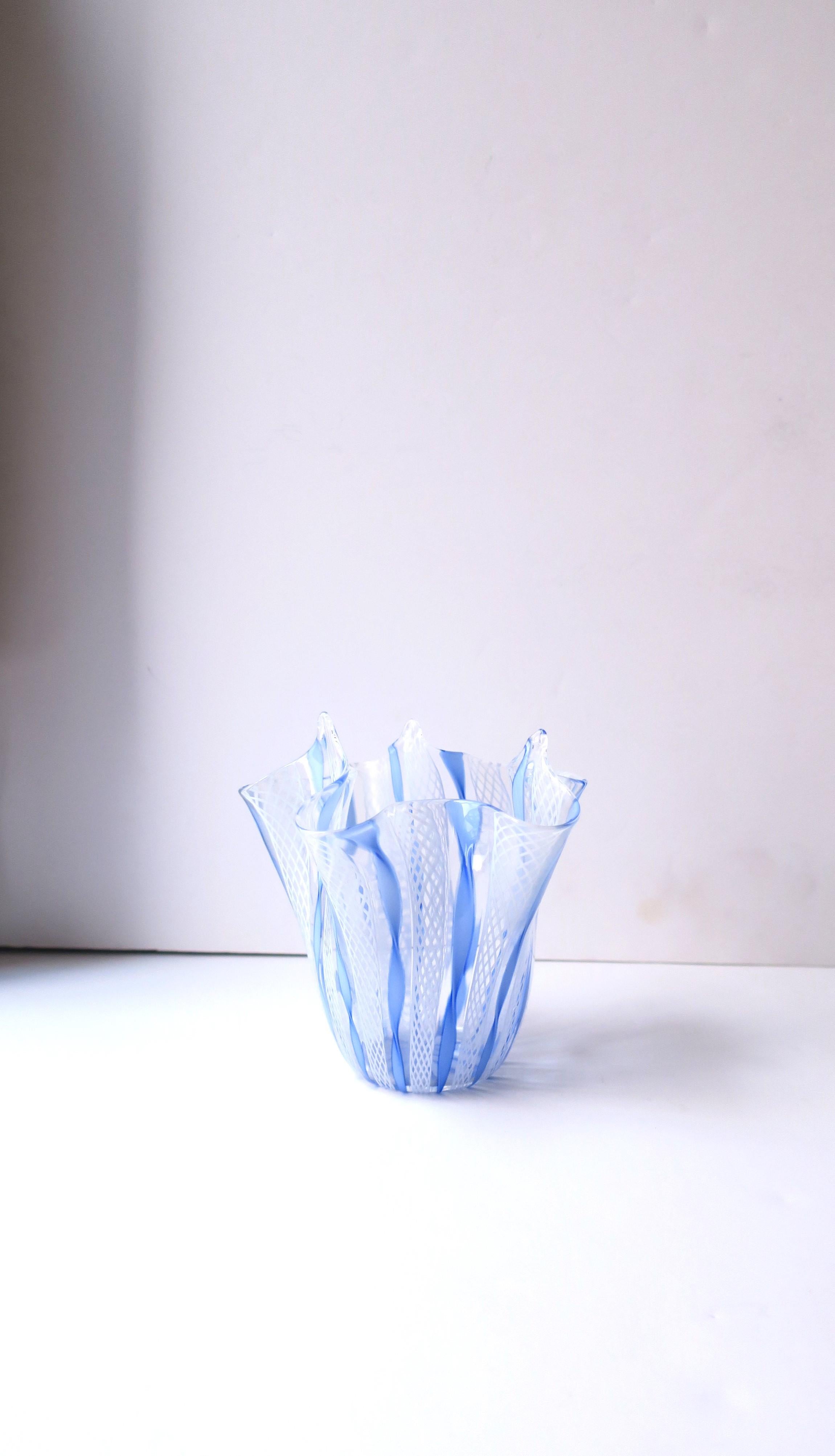A beautiful, authentic, Italian Murano fazzoletto (handkerchief) vase in clear/transparent, blue, and white art glass, in the Venini style, circa mid-20th century, Italy. This beautiful hand-crafted Italian handkerchief vase has intricate design of