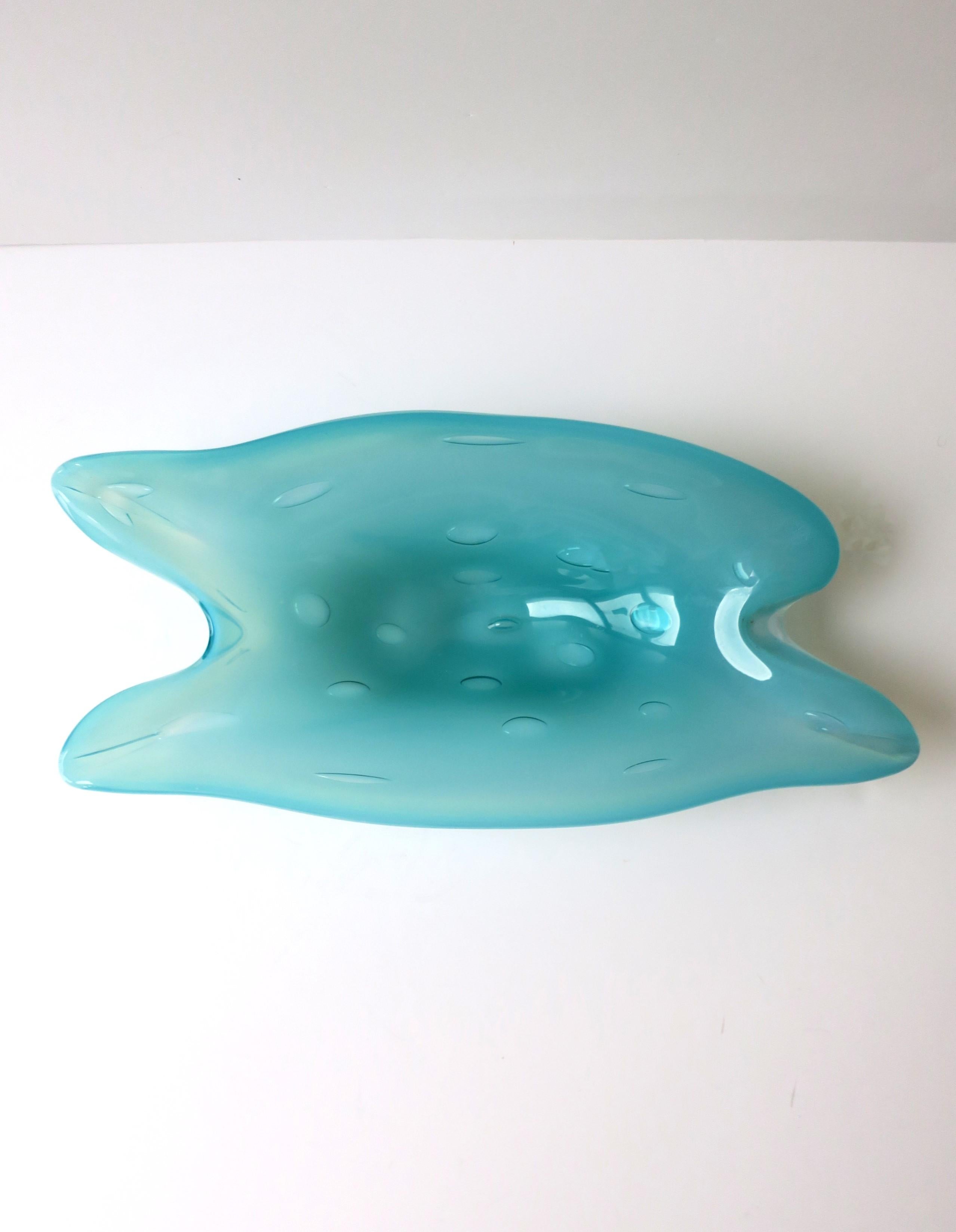 An Italian Murano turquoise blue art glass bowl, in an organic modern form and a big, controlled bubble design, in the style of Barovier & Toso, circa mid-20th century, Italy. A beautiful blue hue and great piece for a sideboard/credenza, cocktail