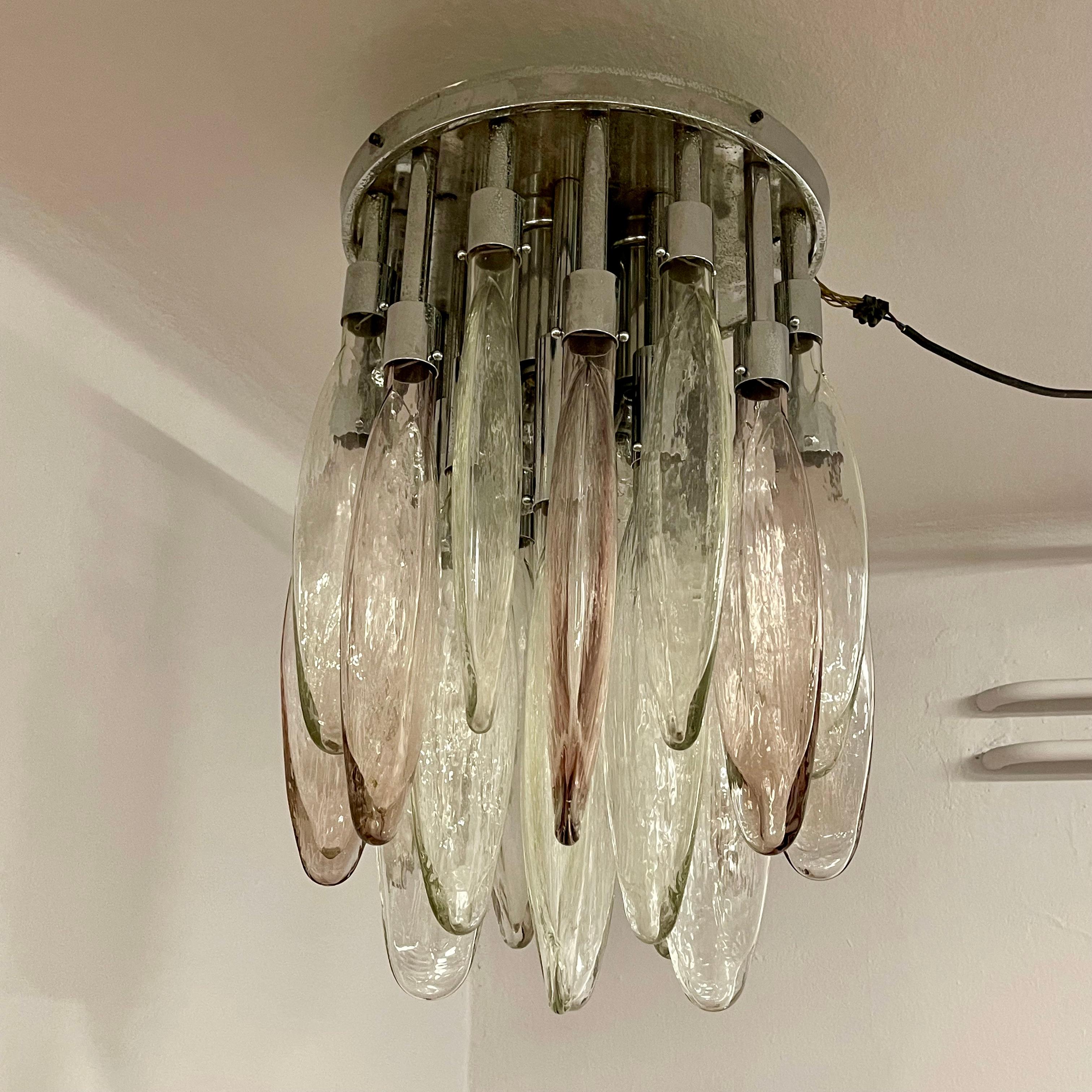 Exceptional chandelier with 25 Murano blown glass elements in two colours, transparent and lilac. Chromed structure (with slight oxidation). The design and quality of the glass make it easy to attribute it to the production of Vetreria Mazzega, even