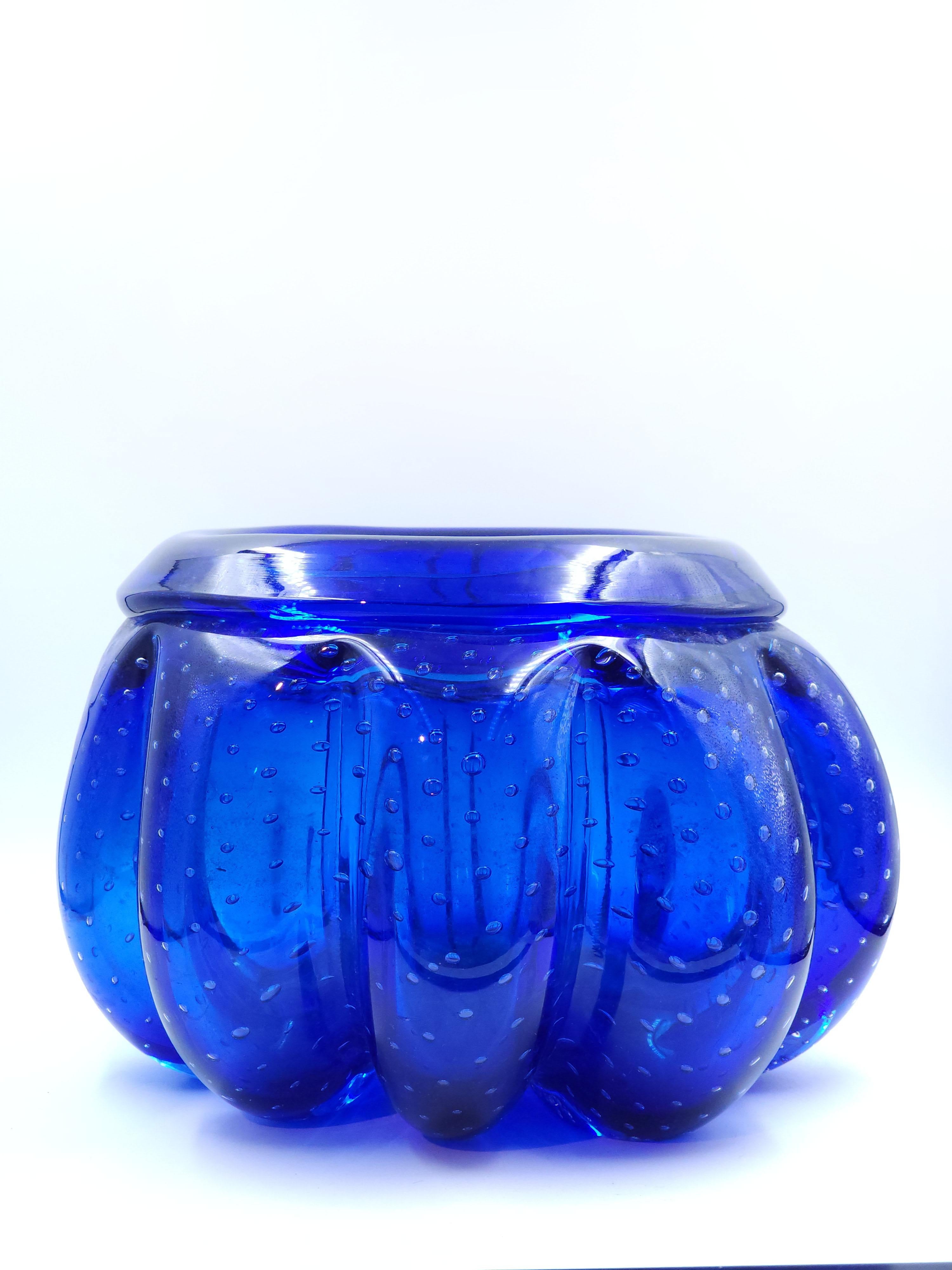 Italian blue Murano art glass center from Seguso, circa 1960
This center has a distinctive design, it has a rounded shape with folds that resemble petals, it has a dreamy pattern that gives it an interesting visual appearance and the blue color is