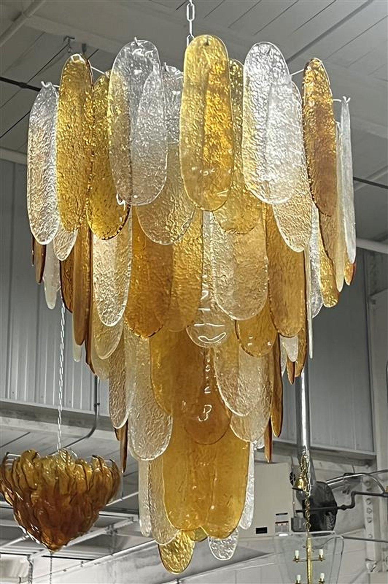Italian Murano Chandeleir with 80 Pieces of Glass
10 Light Sockets 
US Wired
Old new stock vintage mix caramel and clear textured glass, new structure. 
Priced as a single
4 Available 