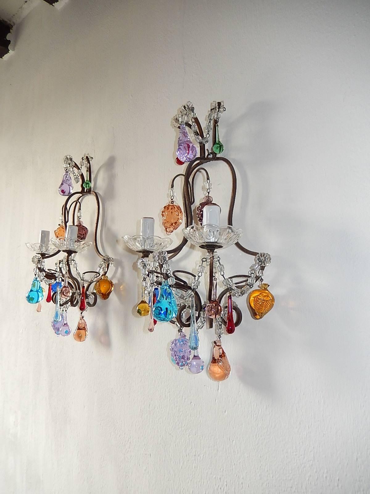 Housing two lights each, sitting in crystal bobeches. Rewired and ready to hang, Adorning macaroni swags, Murano fruit and Drops in all colors. Free priority shipping from Italy.