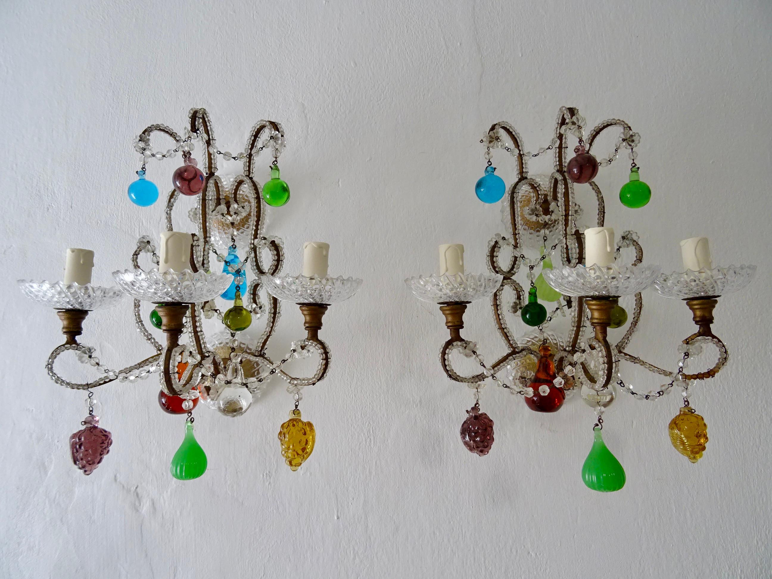 Housing 3 lights each, sitting in rare crystal bobeches.  Double beaded with florets throughout.  Adorning Murano fruit and colored balls.  Back plates have the same bobeches.  Will be wired with certified UL US sockets for the USA and appropriate