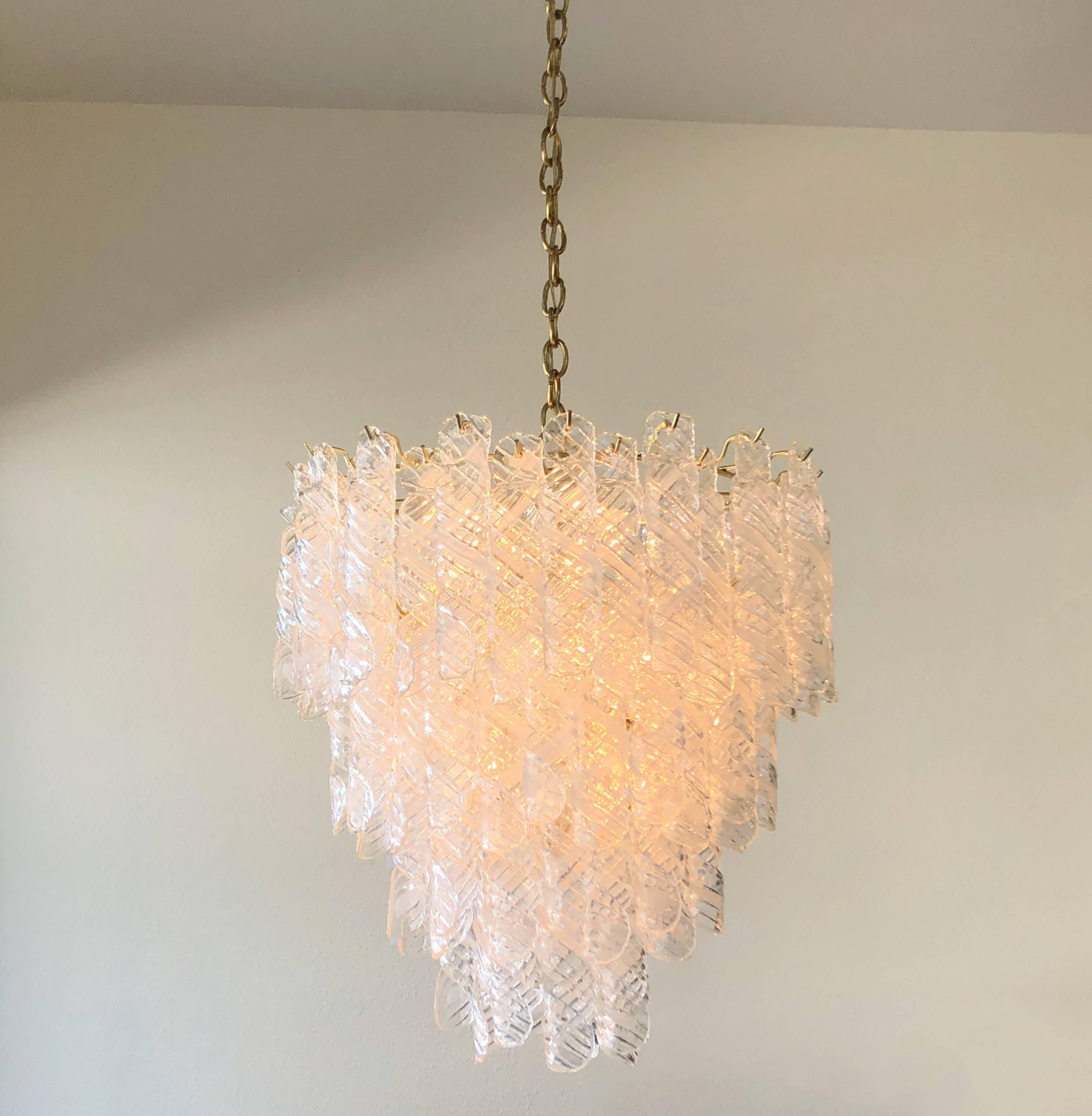 A spectacular Italian Murano glass and brass chandelier, design by Mazzega in the 1970s.
Newly rewired. We can extend or shorten the chain to any length. 
Dimensions without chain: 27” high 24” diameter.
 