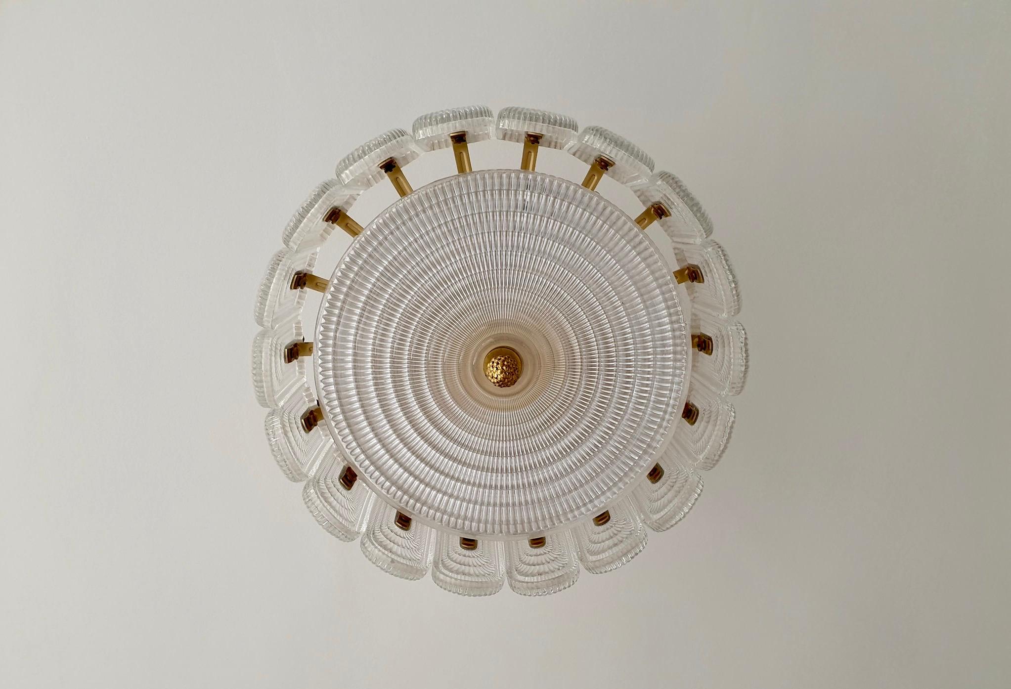 Italian brass and Murano glass flush mount light.
Measures: Diameter 50 cm.
Height 47 cm.