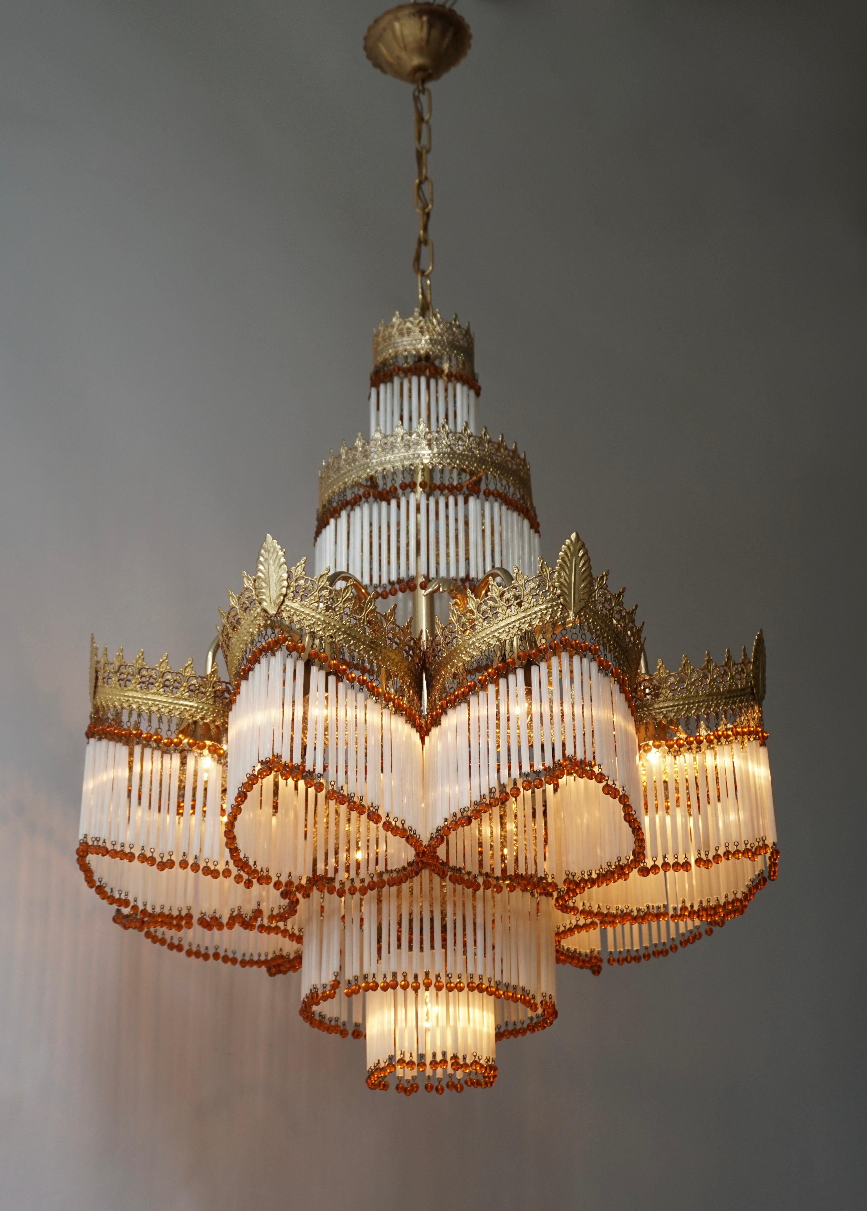 Beautiful large Italian Art nouveau Murano glass and brass gilt chandelier.

The light requires nine single E14 screw fit lightbulbs (60Watt max.) LED compatible.

Measures: 
Diameter 62 cm.
Height fixture 75 cm.
Total height including the chain and