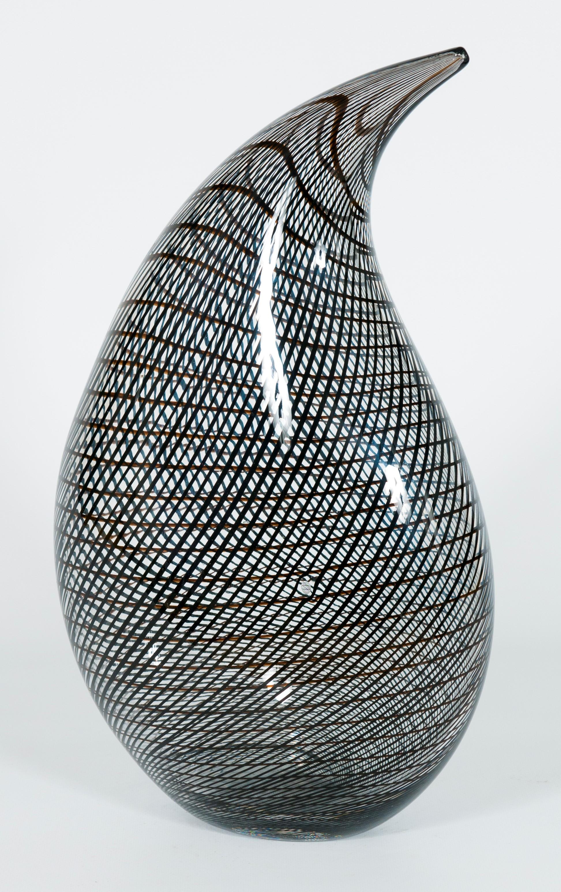 Italian Murano Glass Artistic Sculpture Attributed to Tagliapietra, 1990s.
This is an amazing sculpture realized with transparent Murano glass and many black submerged glass canes that intersect each other, adapting themselves to the surface shape.