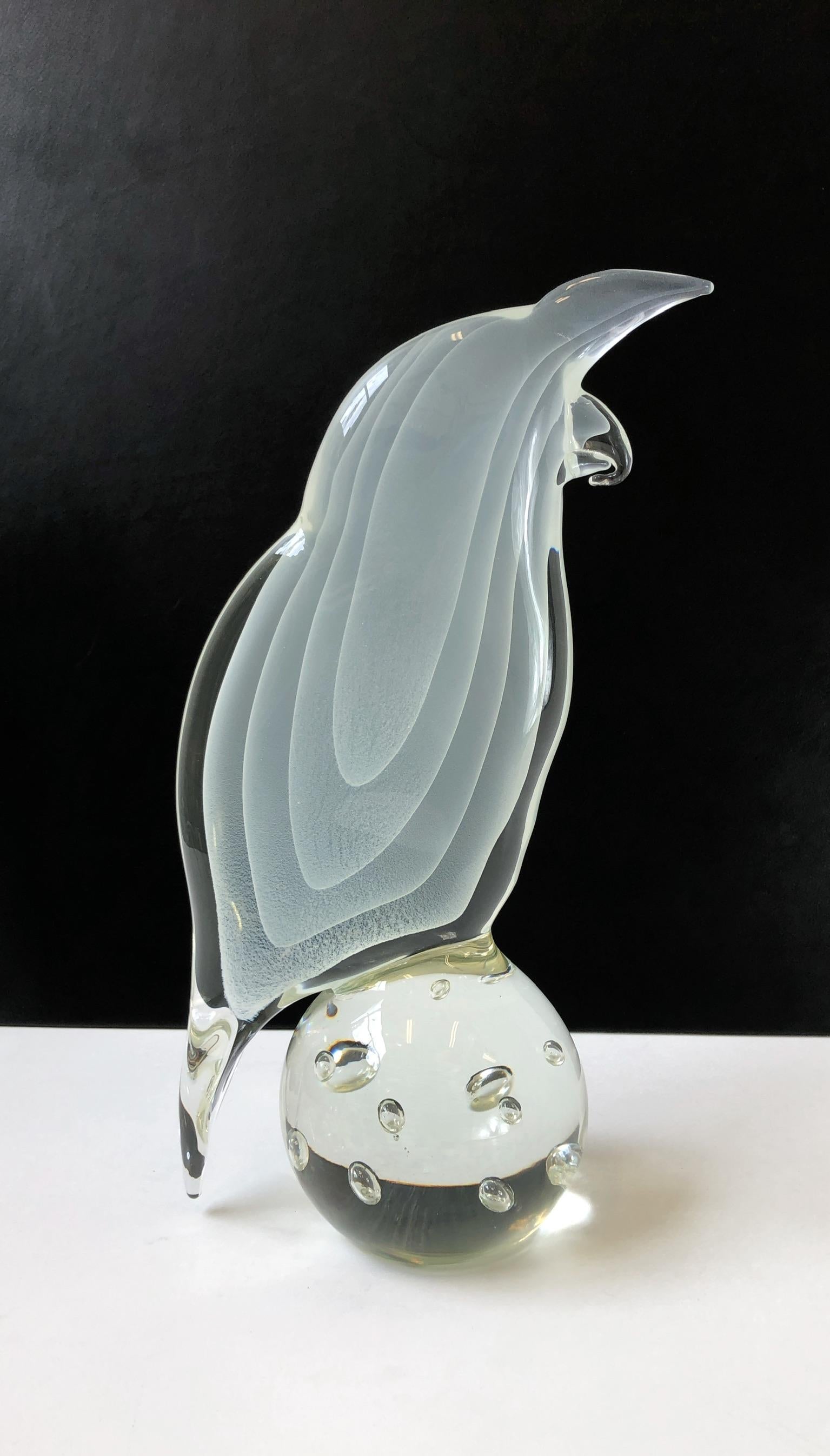 A beautiful Italian white and clear Murano glass bird sculpture by Licio Zanetti for Ultima Crystal Art. The sculpture is signed and retains the Ultima Crystal Art label (see detail photos).

Dim: 16” high 9” wide 5.5” deep.